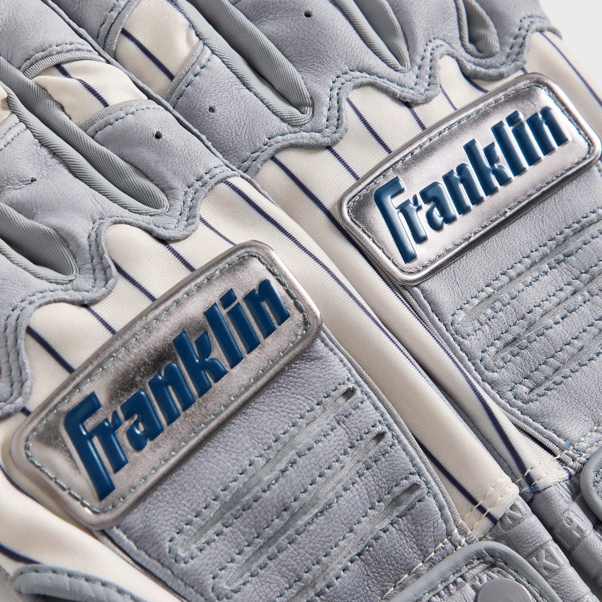 Kith & Franklin CFX Pro batting gloves - close-up detail of Franklin logo badges on palm