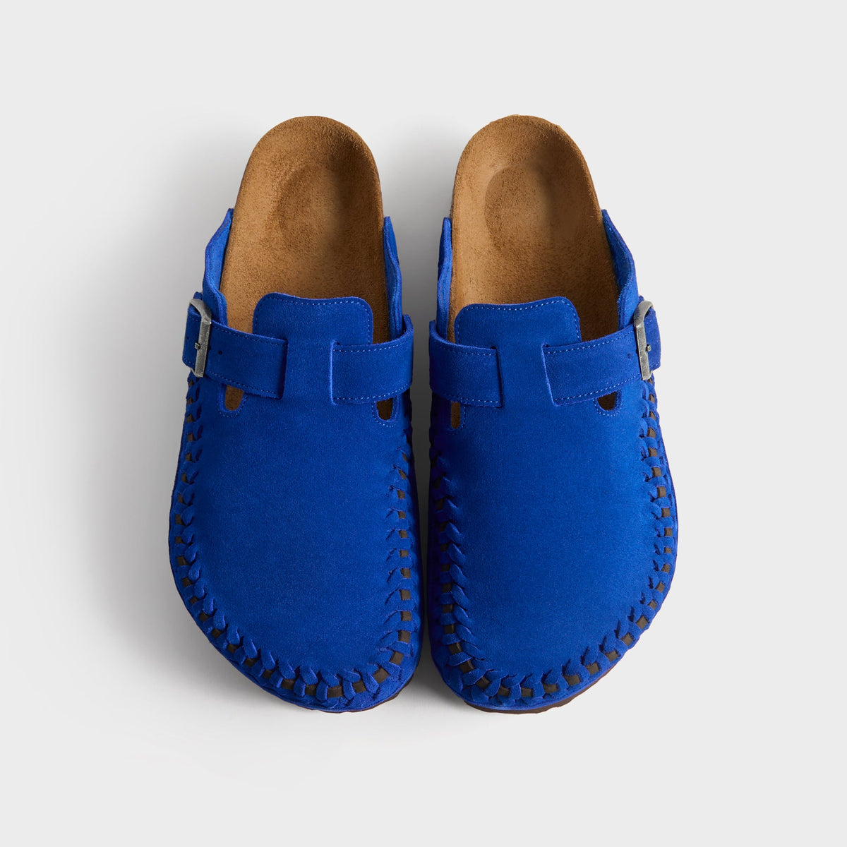 Kith for Birkenstock Boston Braided in Ultra Blue, top-down view of the cobalt pair showing suede uppers, buckles and cork footbeds