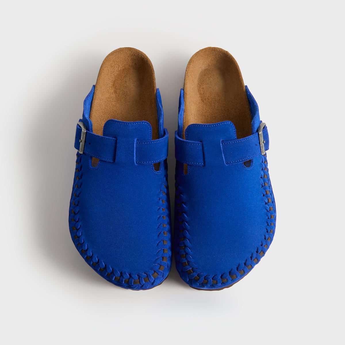 Kith for Birkenstock Women's Boston Braided in Ultra Blue, top-down view of the cobalt pair showing suede uppers, buckles and cork footbeds