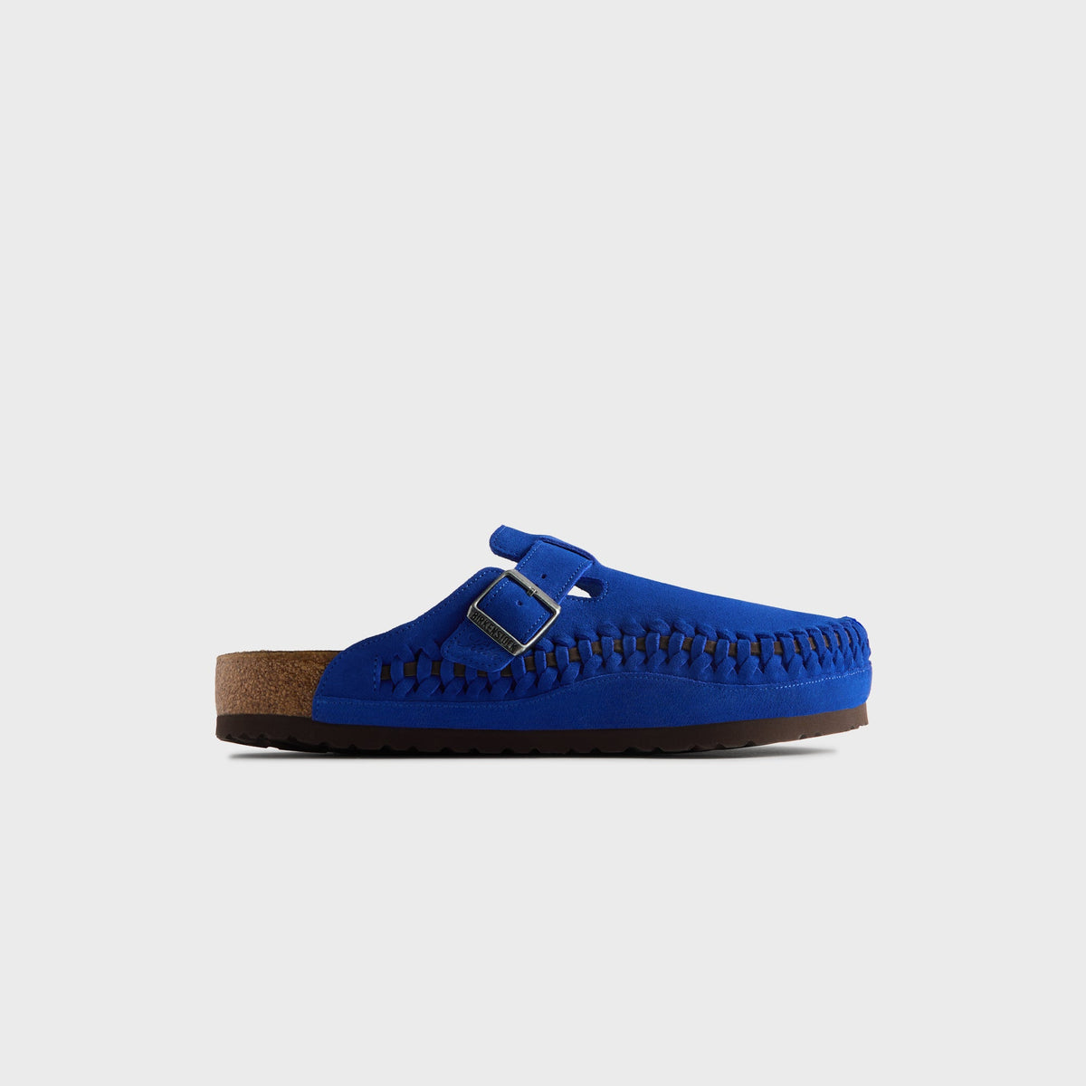 Kith for Birkenstock Women's Boston Braided clog in Ultra Blue, lateral profile of the right cobalt suede mule with buckle and cork footbed
