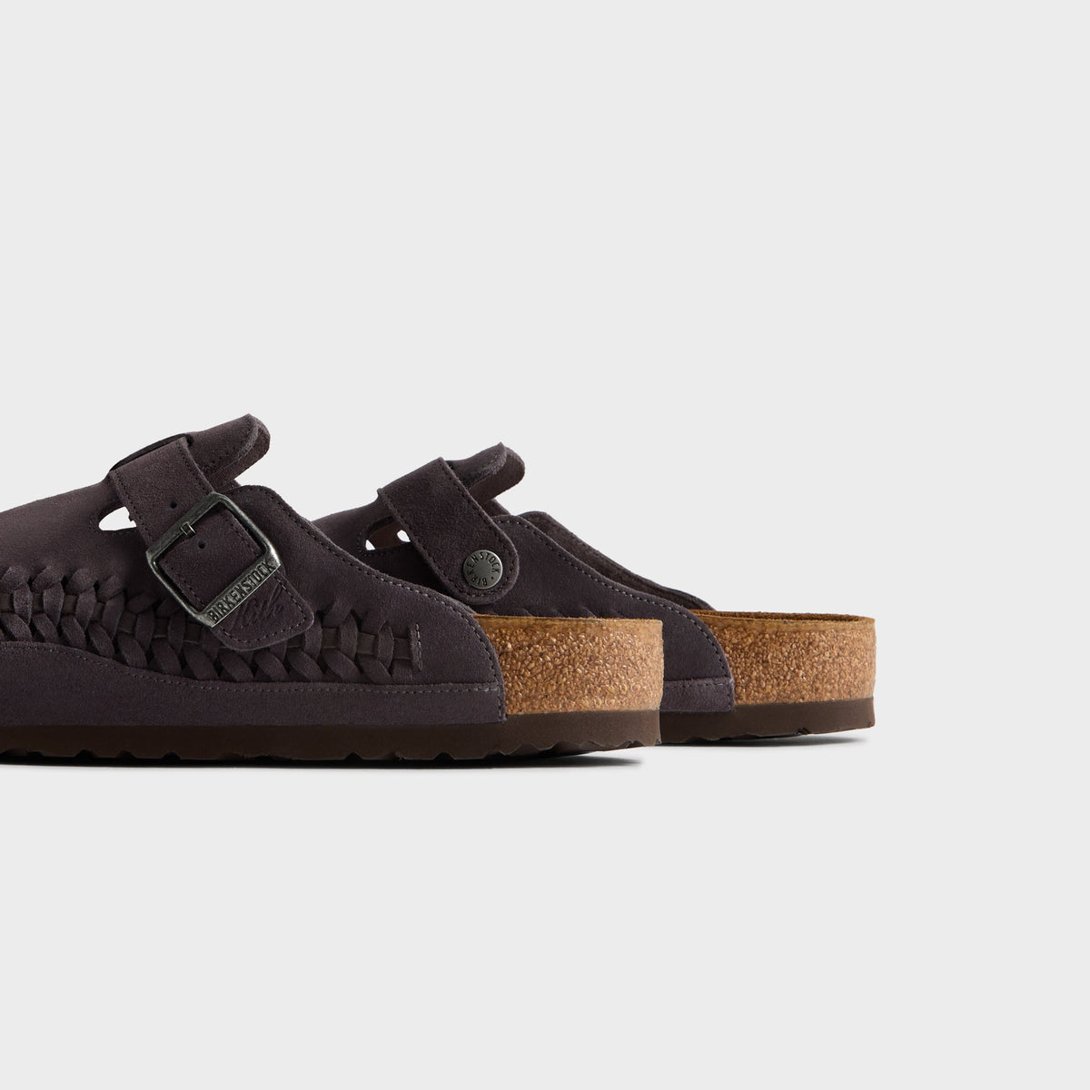 Kith for Birkenstock Boston Braided in Rabbit Grey, close-up of the pair's cork footbeds and heels with buckle straps