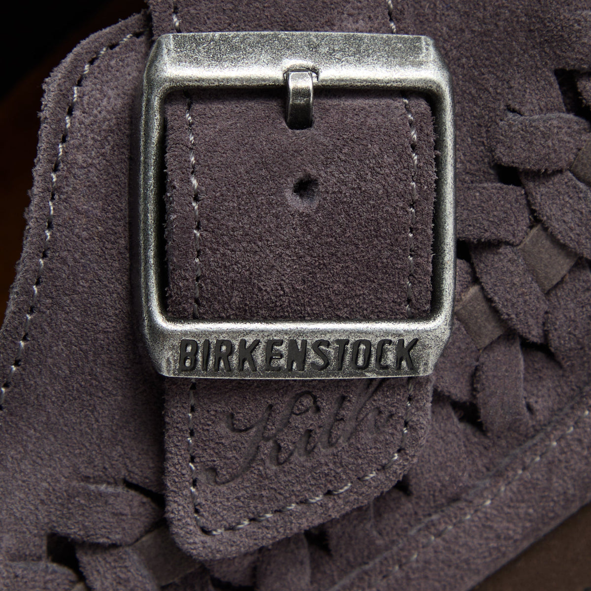 Kith for Birkenstock Boston Braided in Rabbit Grey, macro of the silver buckle embossed Birkenstock with Kith script in the suede