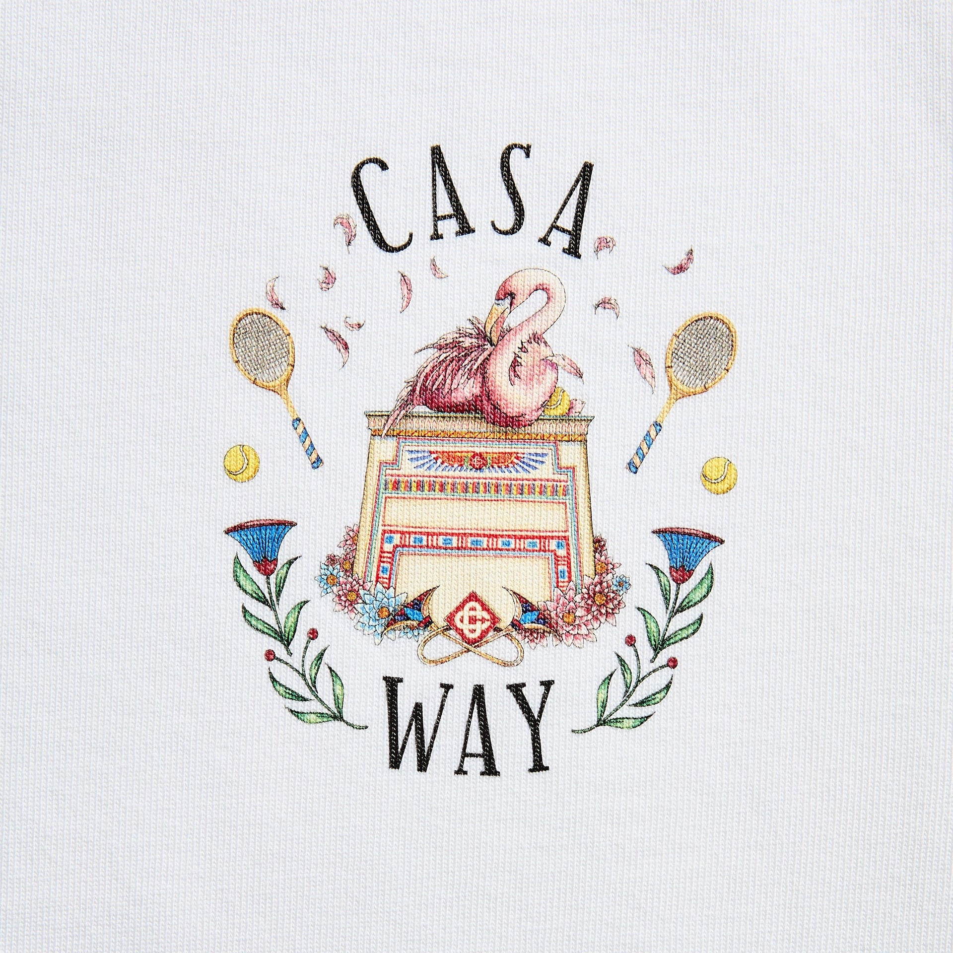 Close-up of Casa Way crest on white: pink flamingos on an Egyptian pedestal with crossed tennis rackets and flowers