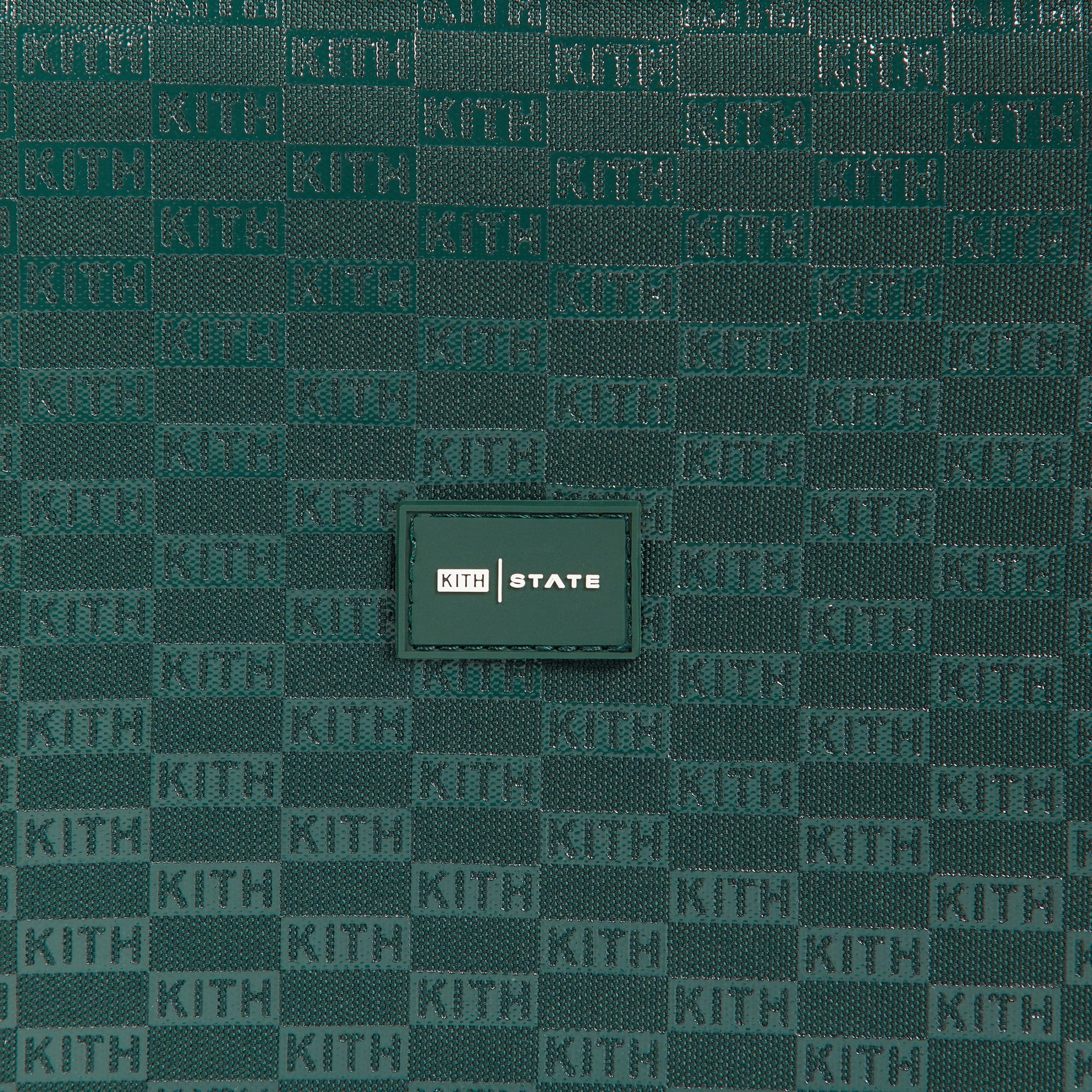 Kith Kids for STATE Rodgers Lunch Box close-up of green KITH monogram fabric and KITH STATE patch