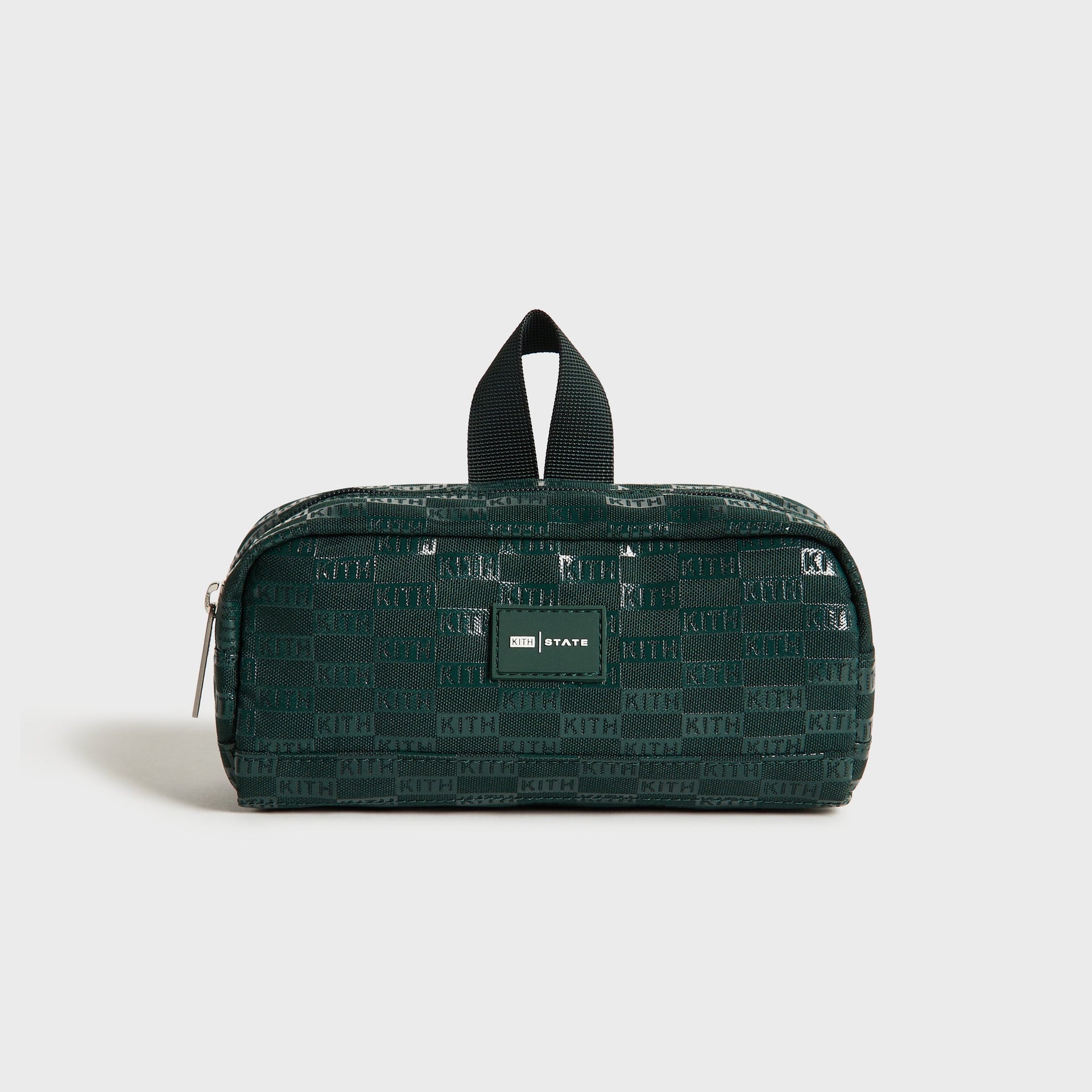 Kith Kids for STATE Clinton Pencil Case in dark green KITH monogram jacquard, front view with top handle and KITH STATE patch