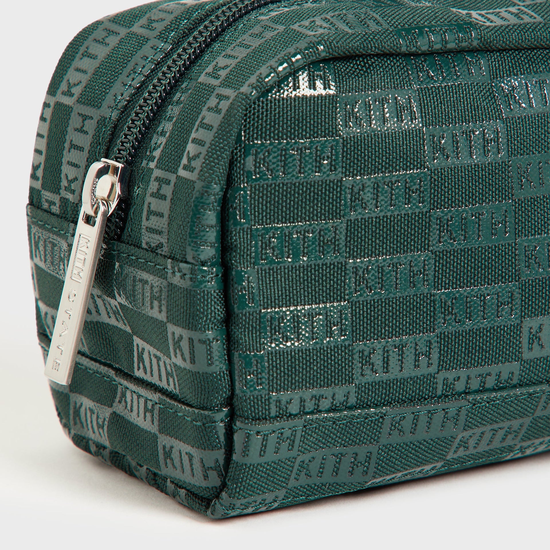 Kith Kids for STATE Clinton Pencil Case, close-up of silver KITH-engraved zipper pull and green KITH monogram