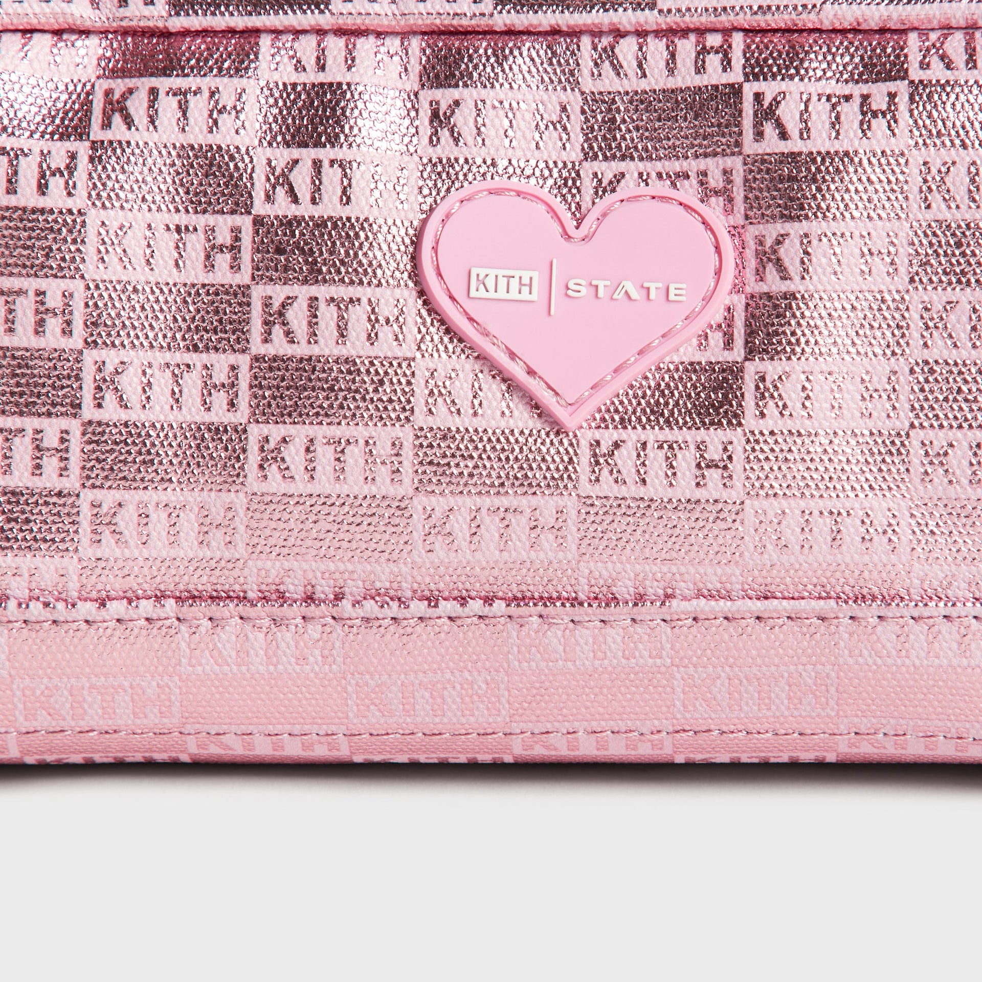 Kith Kids for STATE Clinton Pencil Case in Bloom, close-up of pink heart KITH x STATE patch on metallic monogram