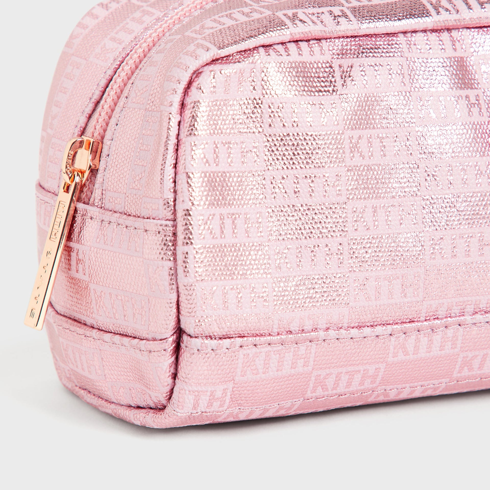 Kith Kids for STATE Clinton Pencil Case in Bloom, close-up of rose gold KITH zip pull on metallic pink monogram