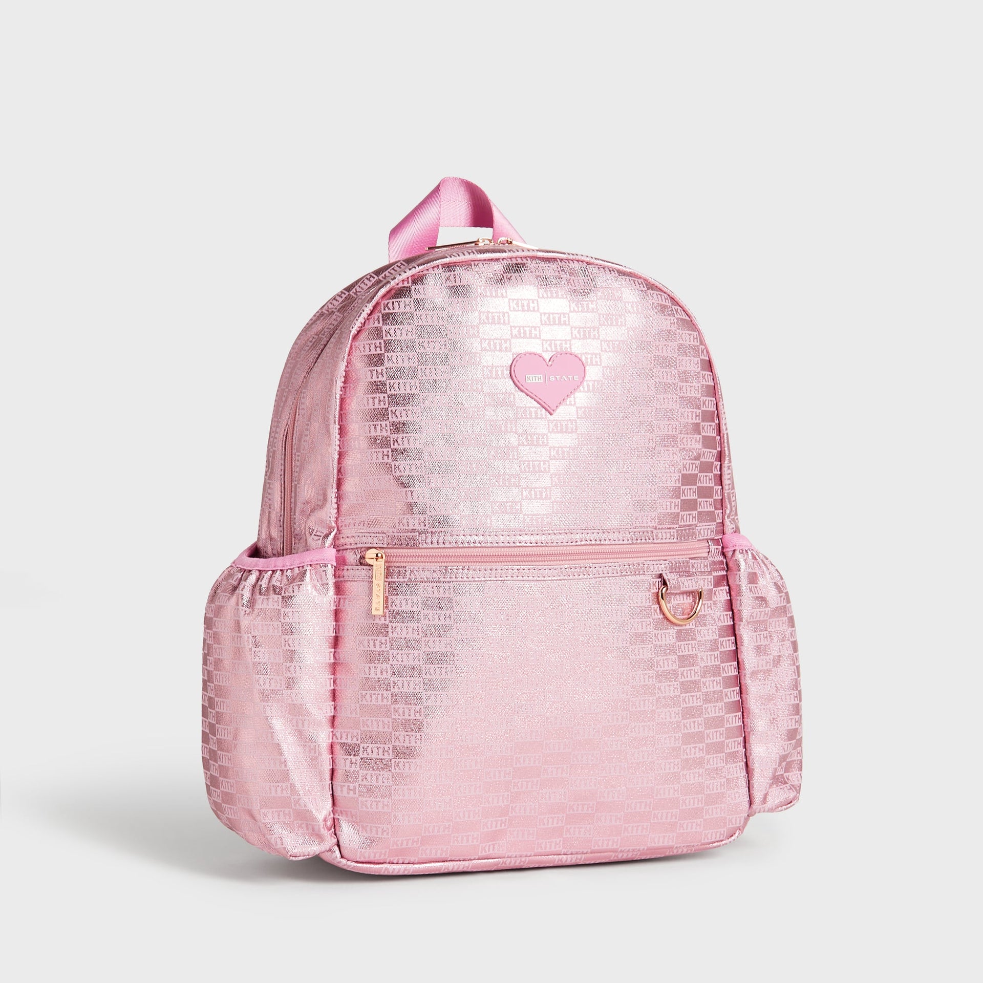 Kith Kids for STATE Kane Backpack in metallic pink monogram, three-quarter angled view