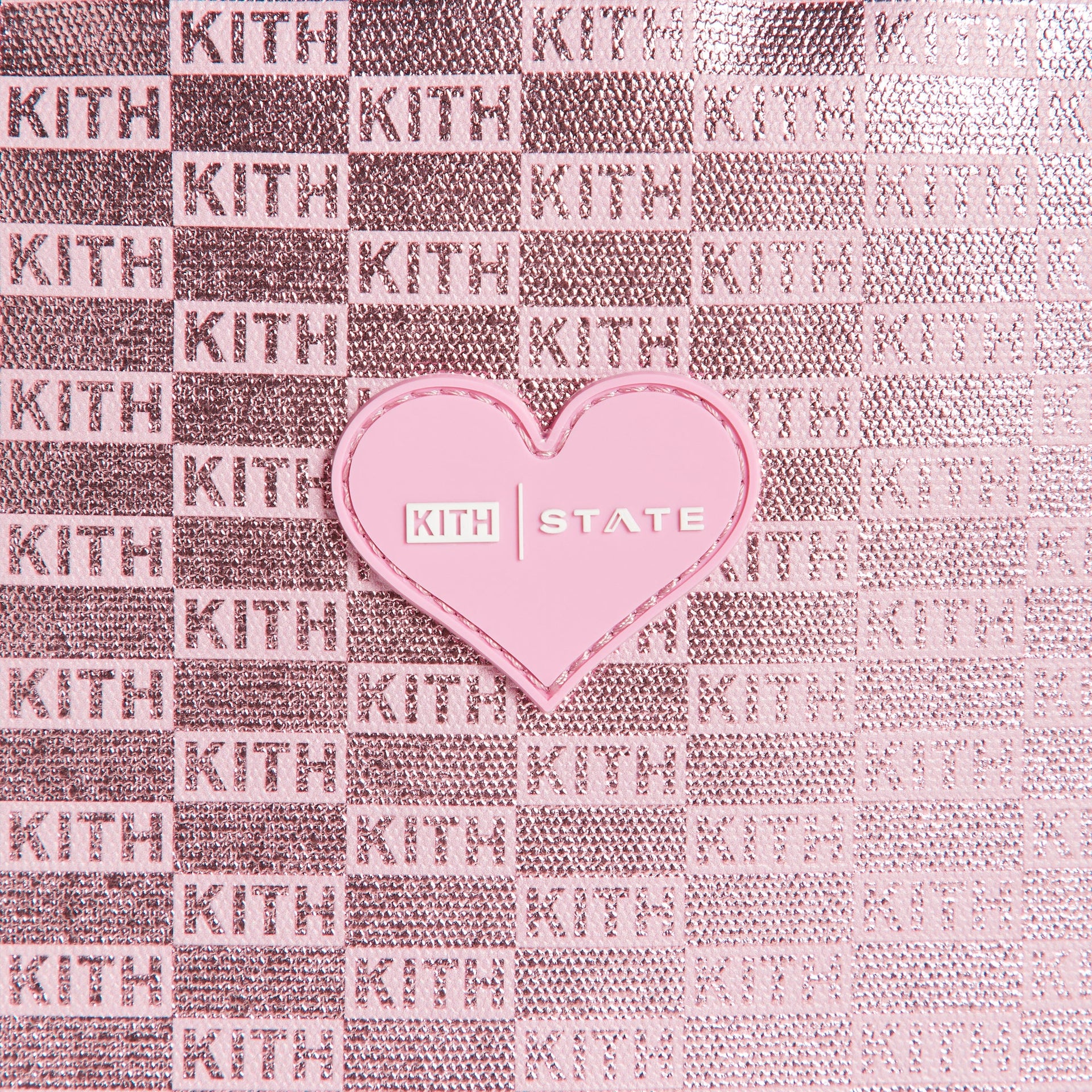 Kith Kids for STATE Backpack close-up of pink heart Kith x State patch on metallic monogram