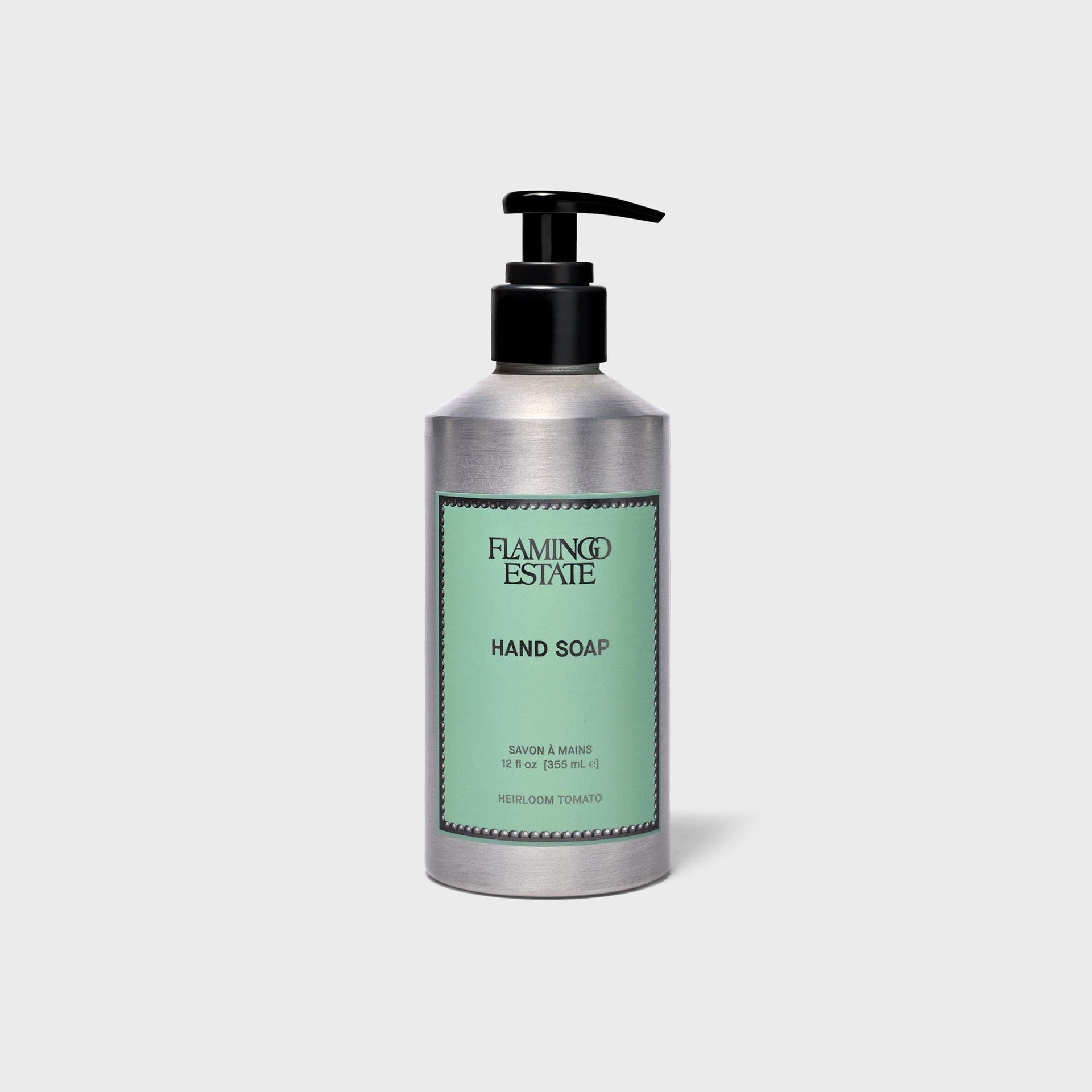 Flamingo Estate Heirloom Tomato hand soap in brushed aluminum bottle with green label and black pump