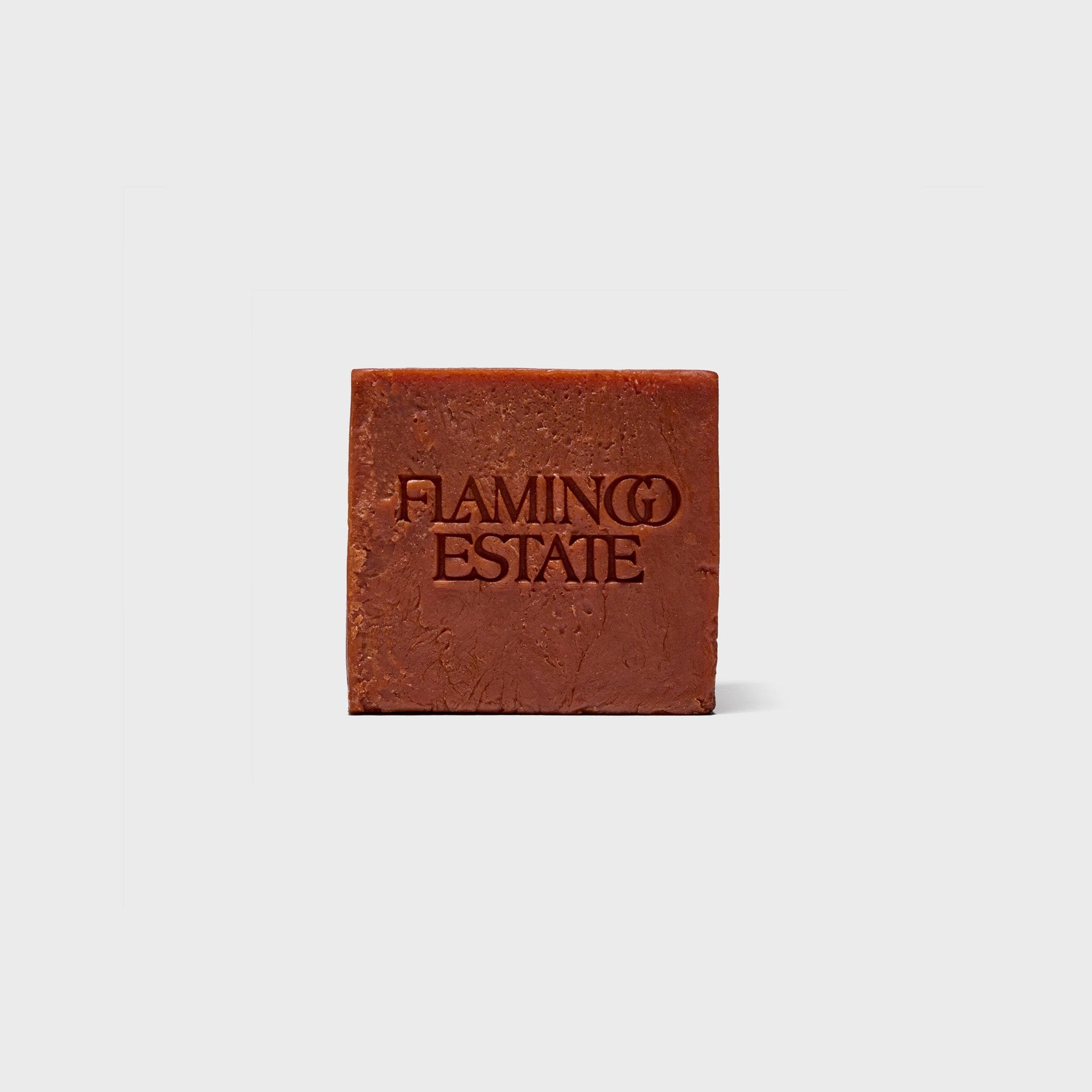 Flamingo Estate Heirloom Tomato soap brick, terracotta-red square bar embossed with Flamingo Estate logo
