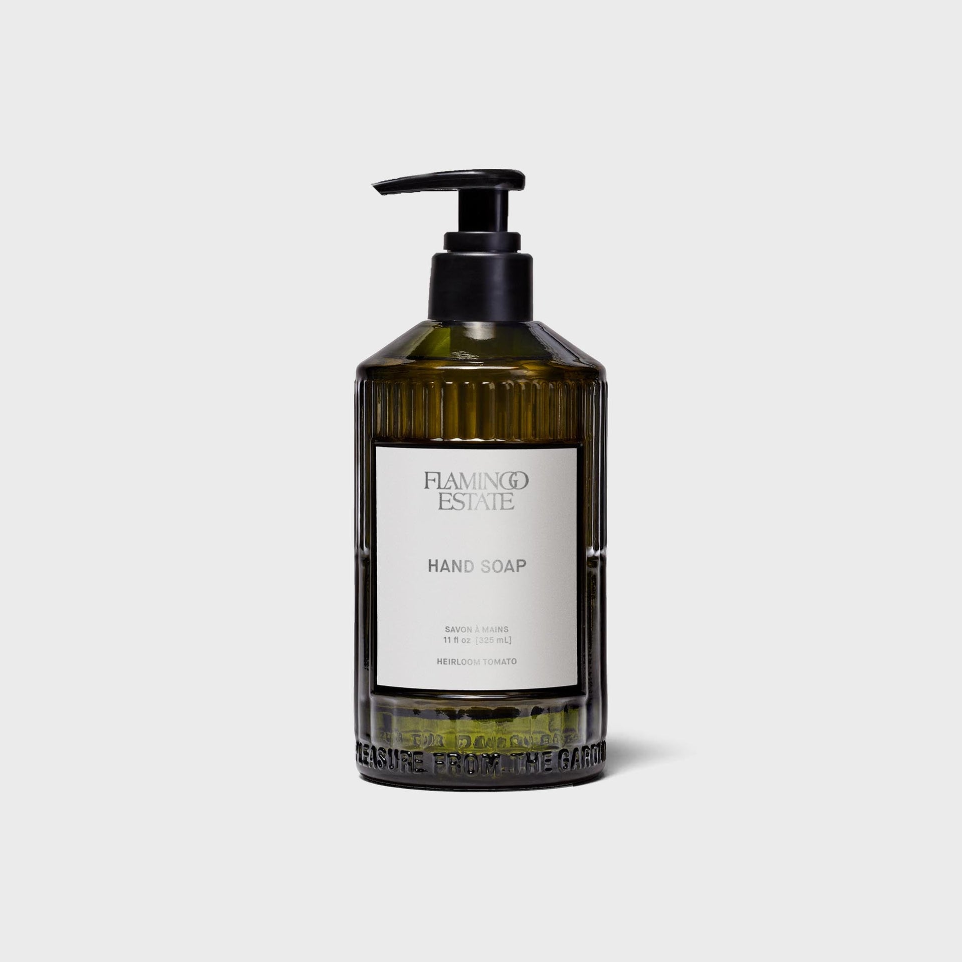 Flamingo Estate Heirloom Tomato hand soap in ribbed olive-green glass bottle with black pump and white label