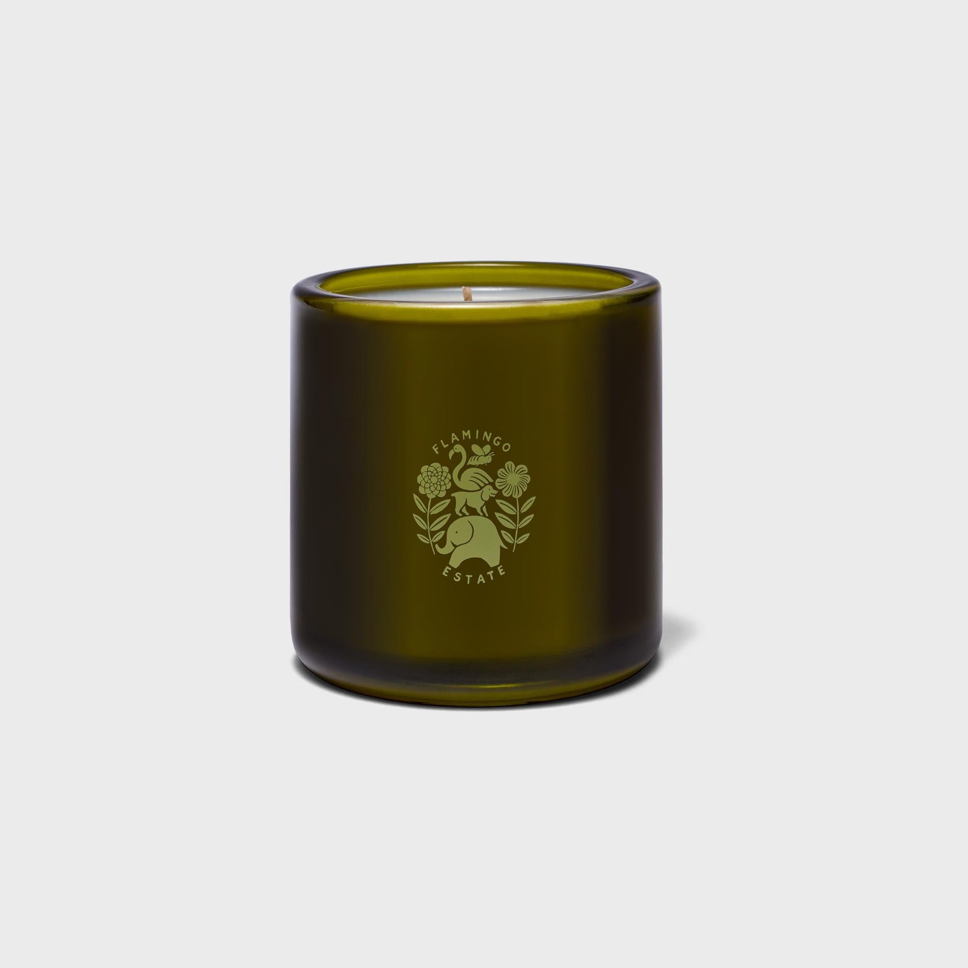 Flamingo Estate Prinsesstärta candle, olive-green glass jar showing botanical Flamingo Estate crest emblem, unlit