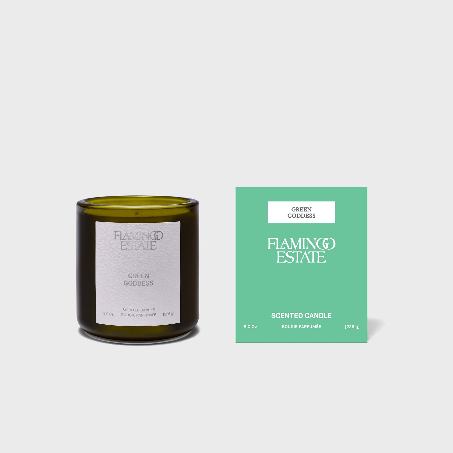 Flamingo Estate Green Goddess 226g candle, white-labeled olive jar beside its green scented-candle gift box