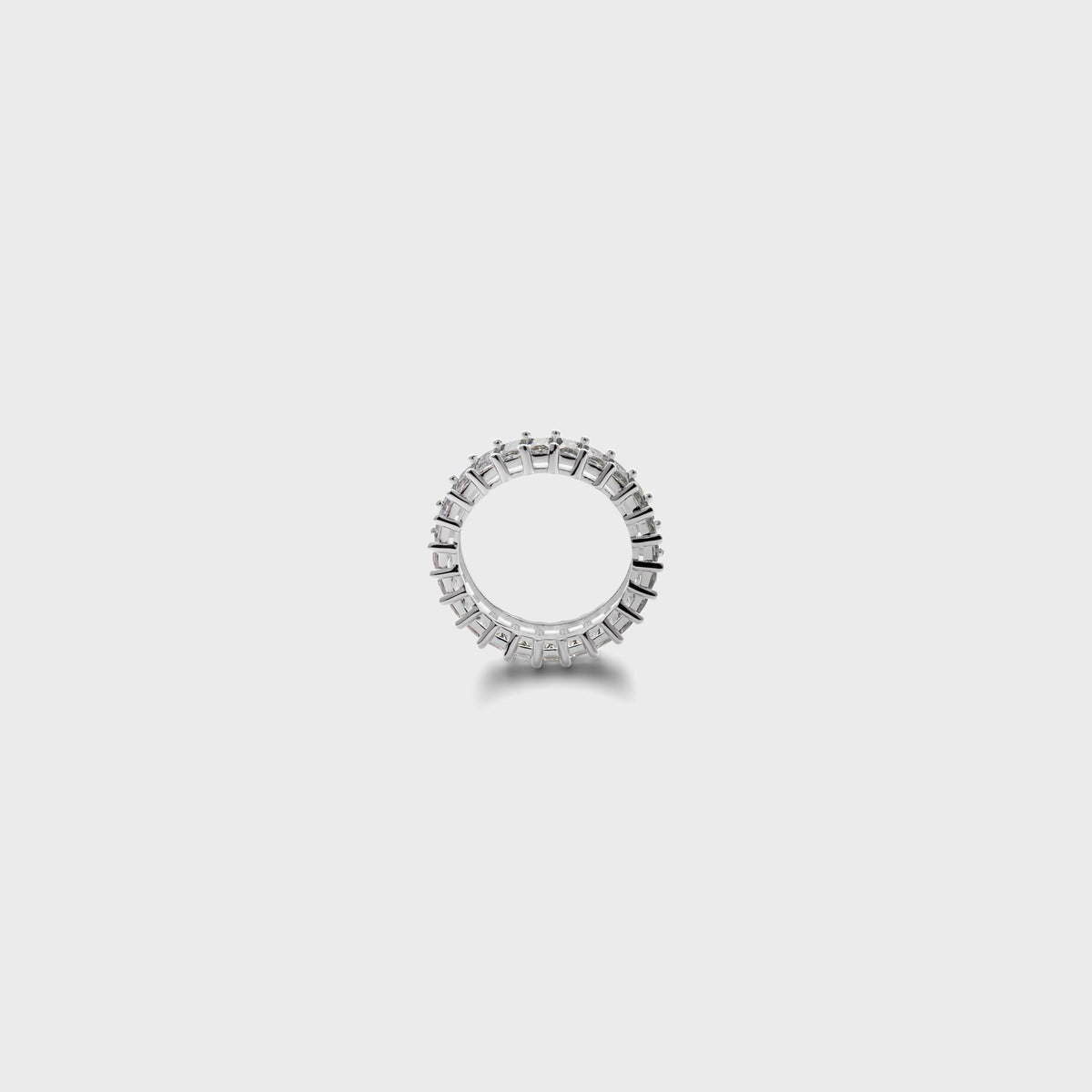 Hatton Labs Baguette Eternity Ring in white, side-on view of the band profile with claw prongs and open center