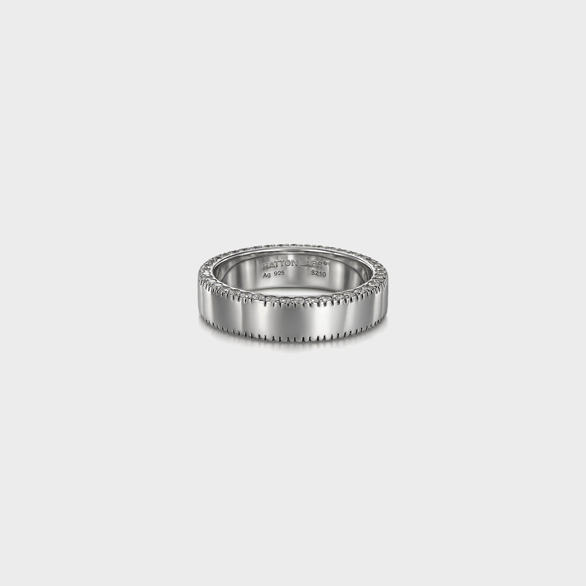 Hatton Labs Infinity Ring in sterling silver, front view of wide polished band with stamped Ag 925 and beaded stone edge