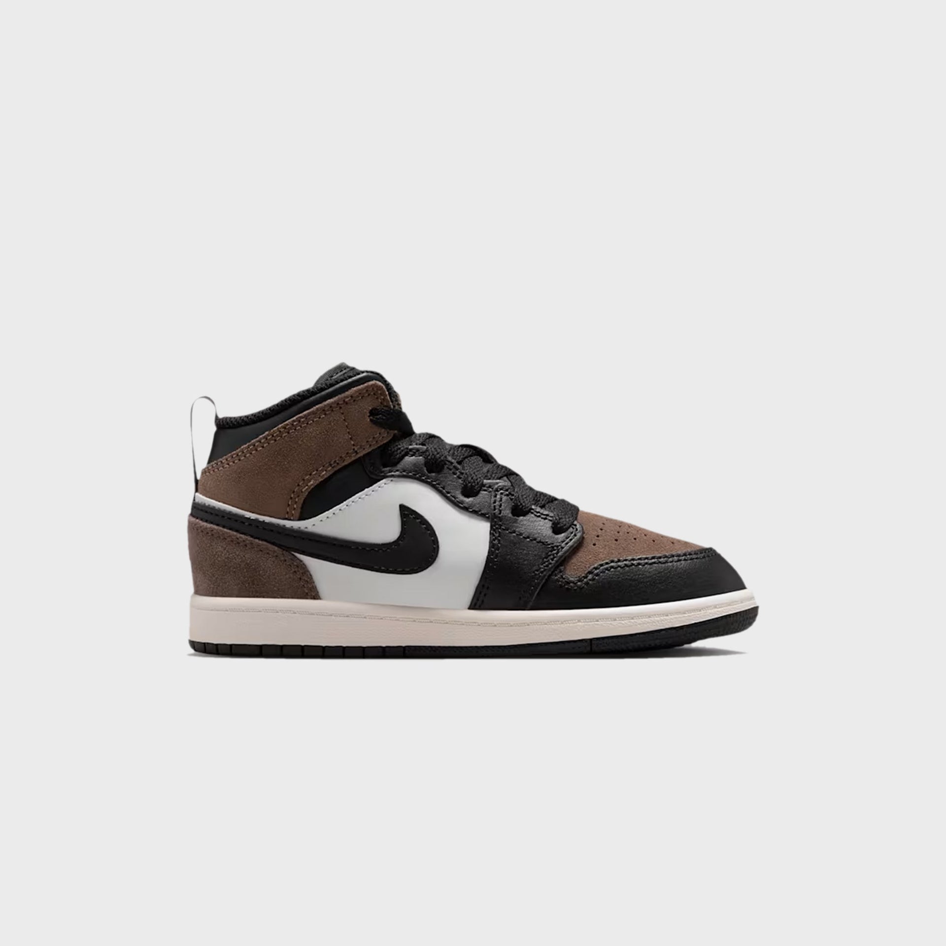PS Air Jordan 1 Mid lateral profile in brown suede, white and black with a black Swoosh and sail sole
