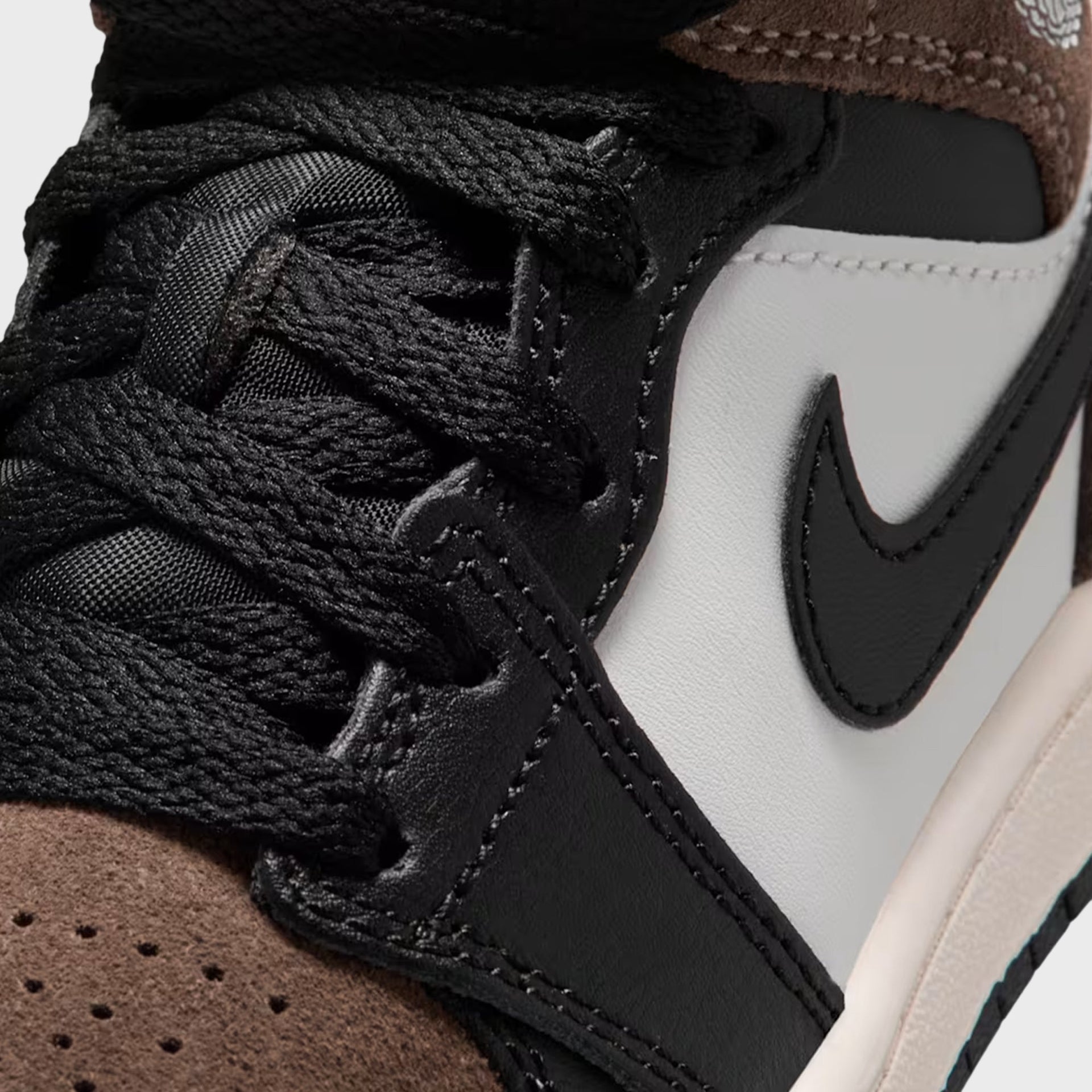 PS Air Jordan 1 Mid detail of black laces, grey panel, black Swoosh and Palomino suede toe