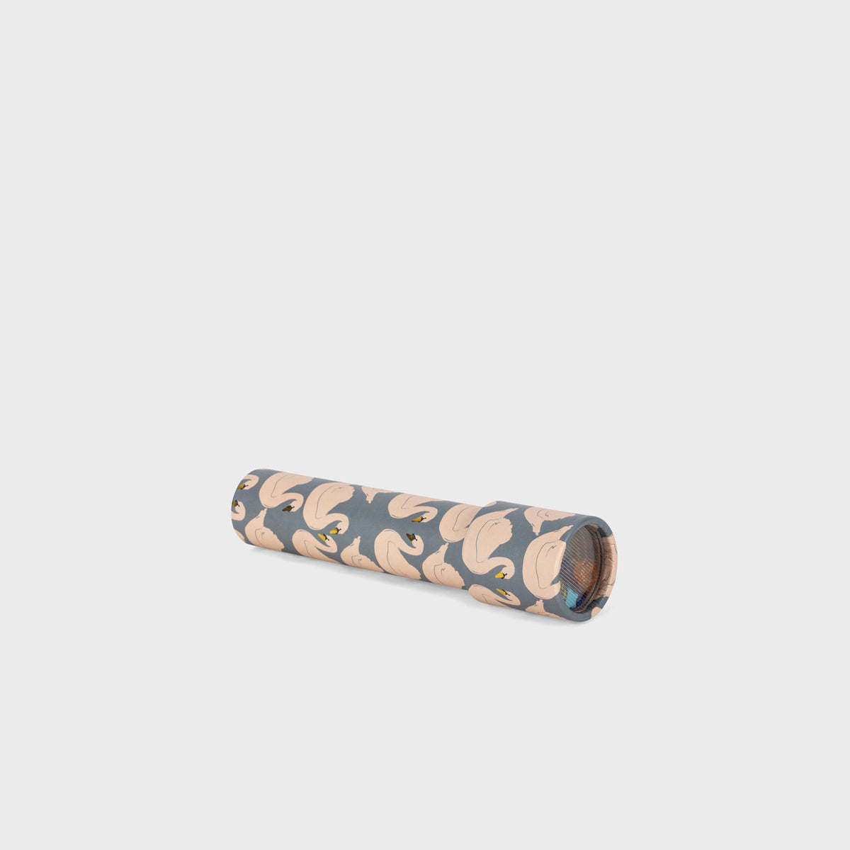 Konges Sløjd Kaleidoscope toy in Swan print, rolled cylindrical viewer with a blue floral fabric pattern