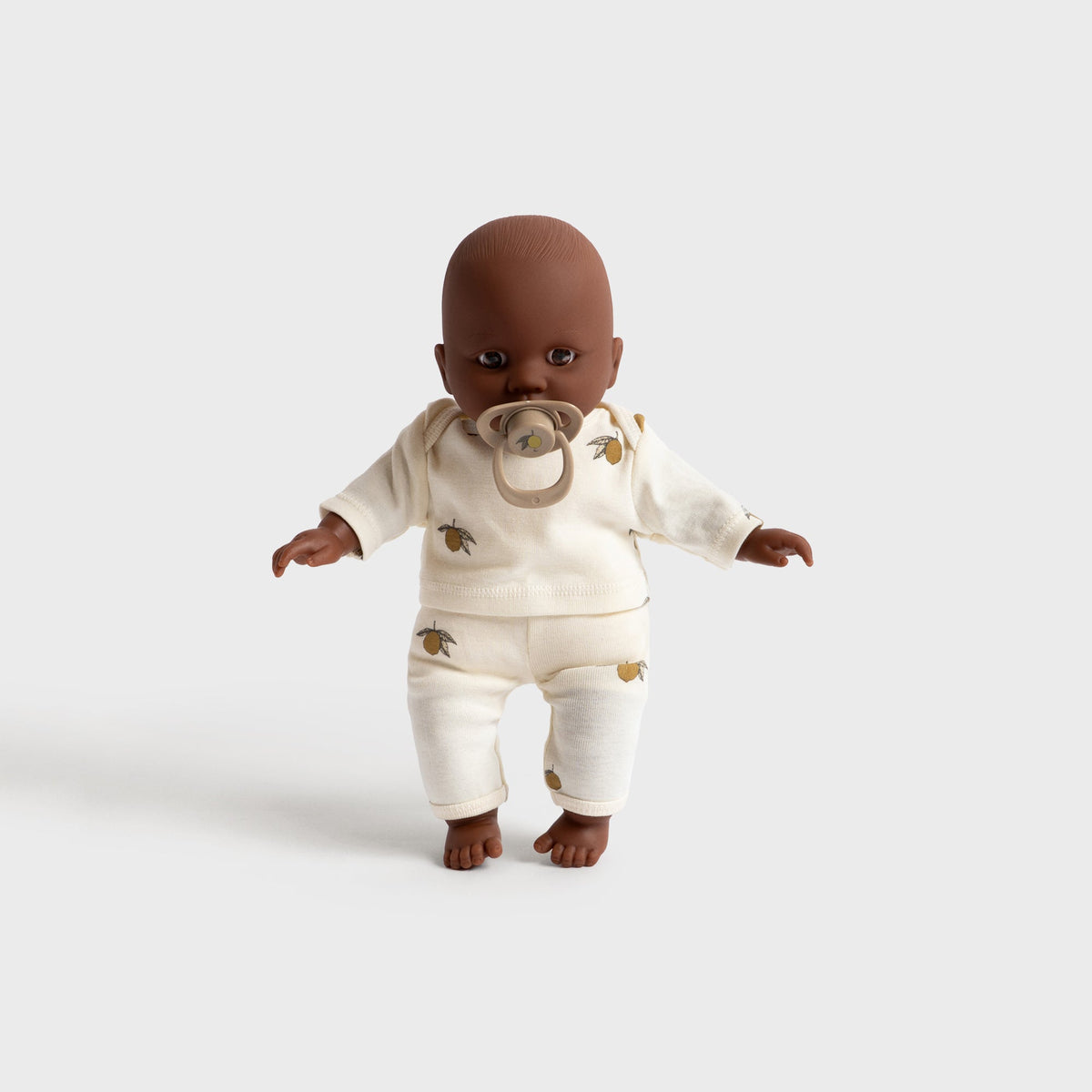 Konges Sløjd Billie the Doll in Multi, soft baby doll in a cream knit outfit, standing front view