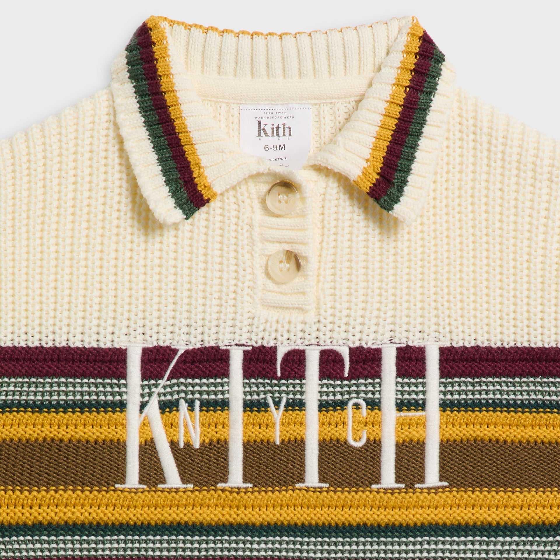 Close-up of the Kith Baby Chunky Knit Rugby Shirt's striped collar, button placket and Knyth lettering