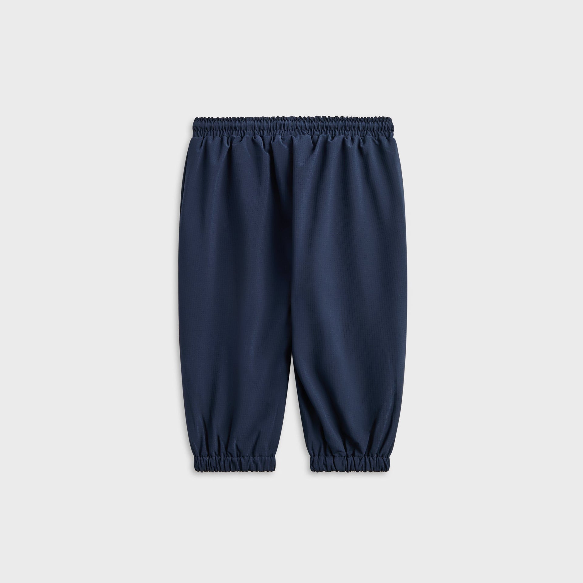 Kith Baby Mercer 8 Pant in Nocturnal navy, plain back view with elastic waist and cuffed hems