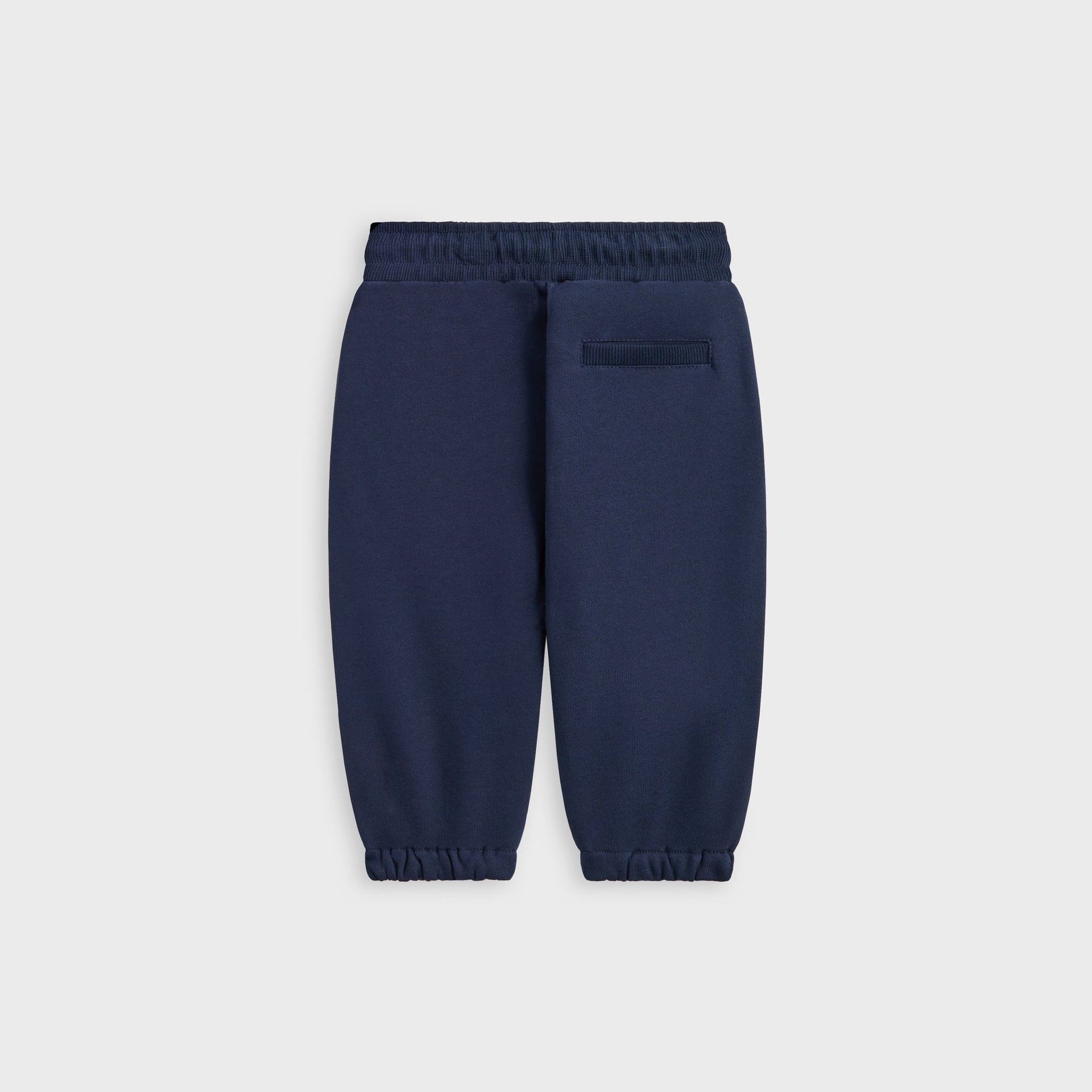Kith Baby Williams II Pant in navy fleece, back flat lay showing elastic cuffs and welt pocket
