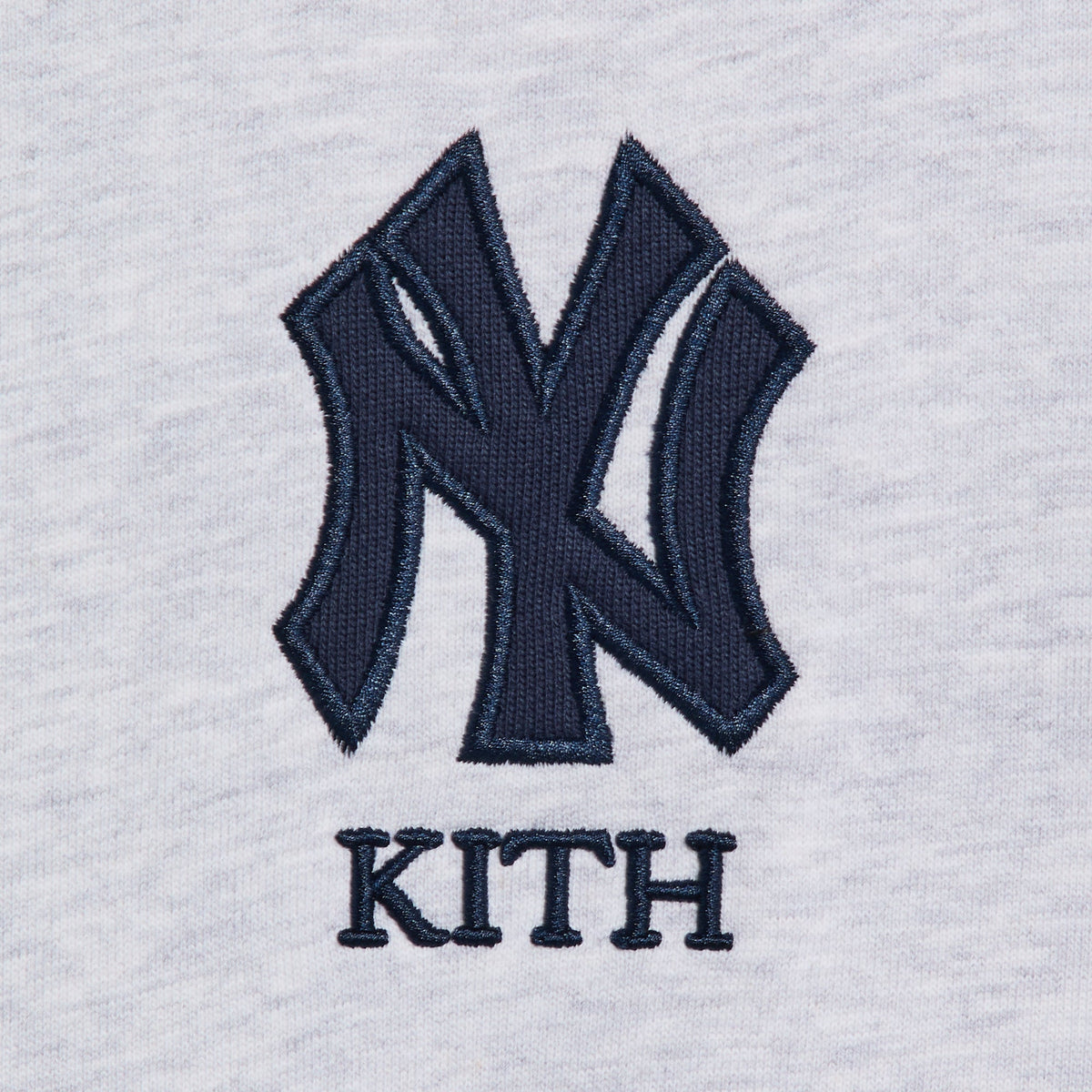 Kith Baby for the New York Yankees Nelson Crewneck, close-up of the embroidered NY Yankees logo and Kith wordmark on the chest