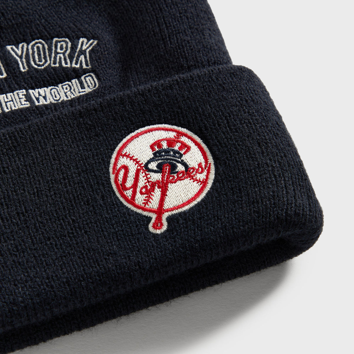 Kith Baby & '47 for the New York Yankees acrylic beanie in Nocturnal navy, close-up of the embroidered Yankees baseball script logo patch