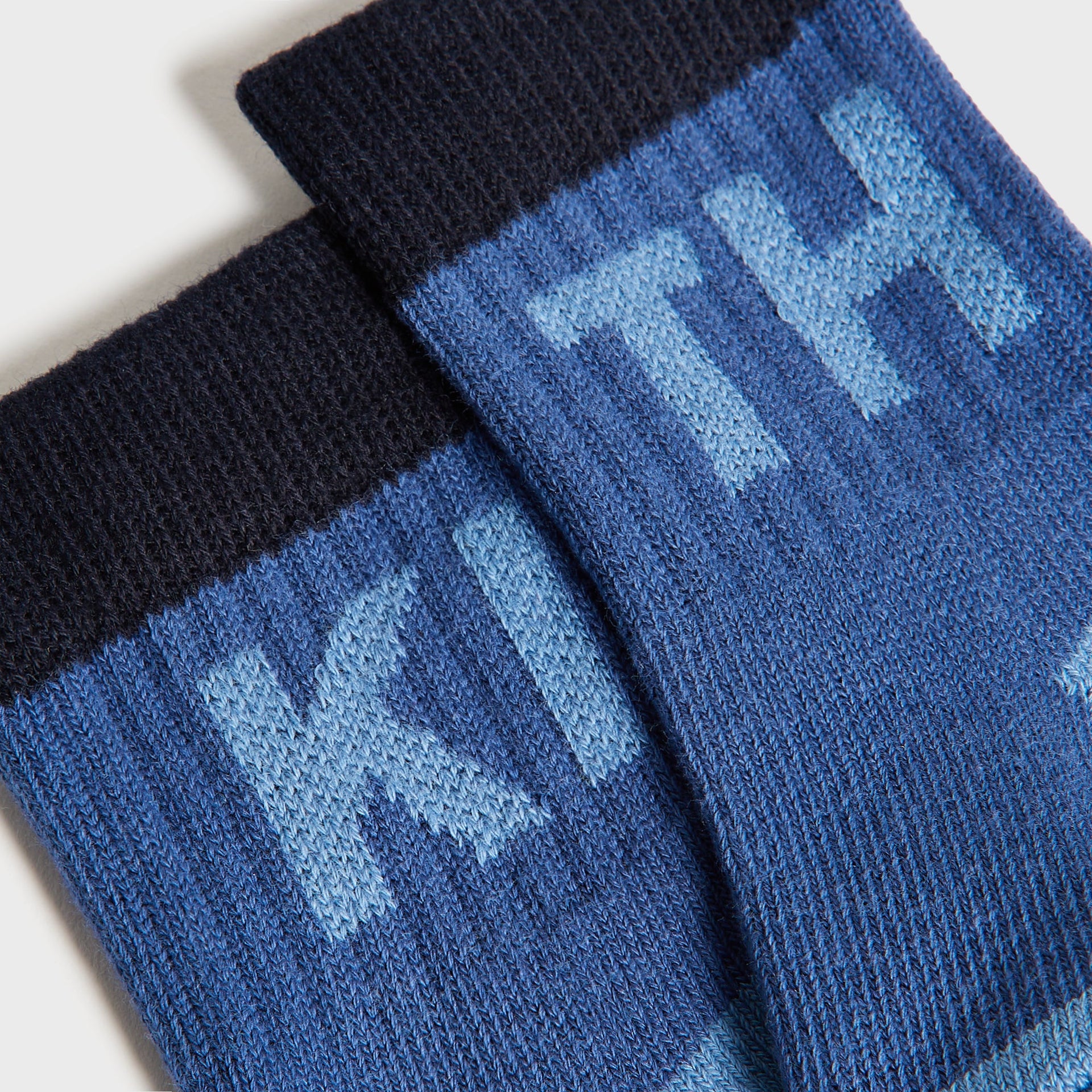 Kith Baby Color-Blocked Crew Socks, close-up of blue and navy cuffs with light blue KITH jacquard lettering
