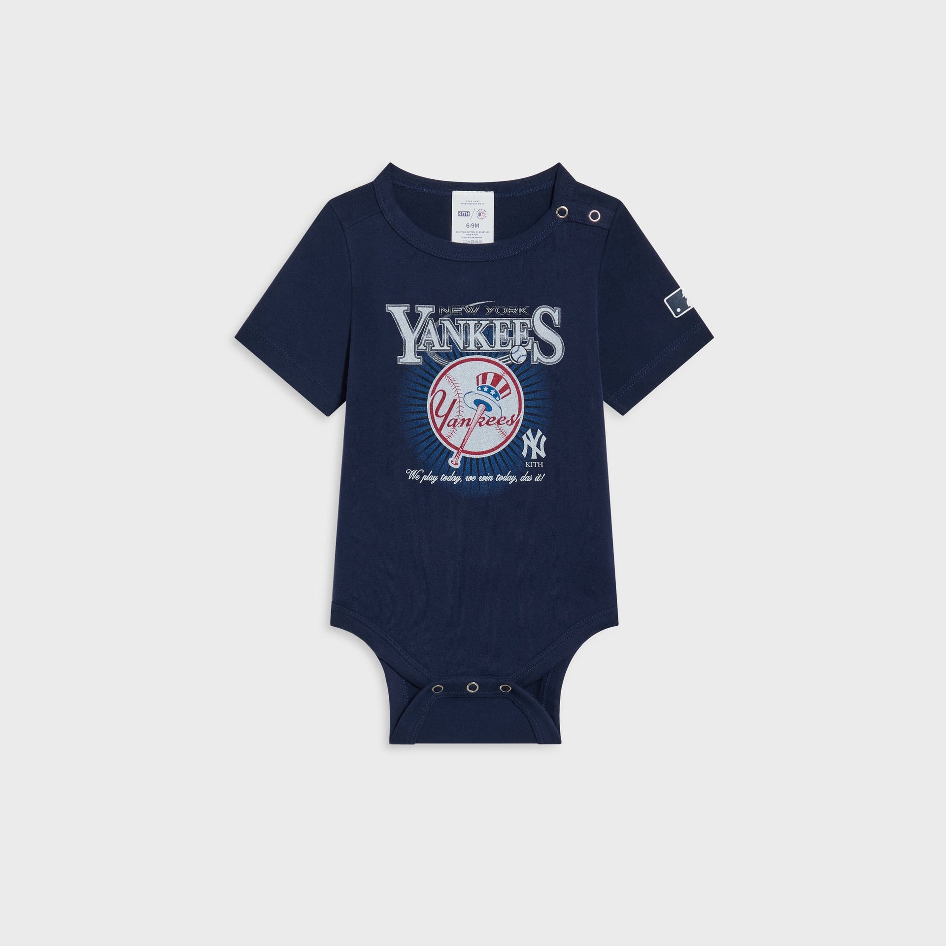 Kith Baby for the New York Yankees Legacy Bodysuit in Nocturnal navy, flat lay showing the vintage Yankees graphic and MLB patch on the sleeve