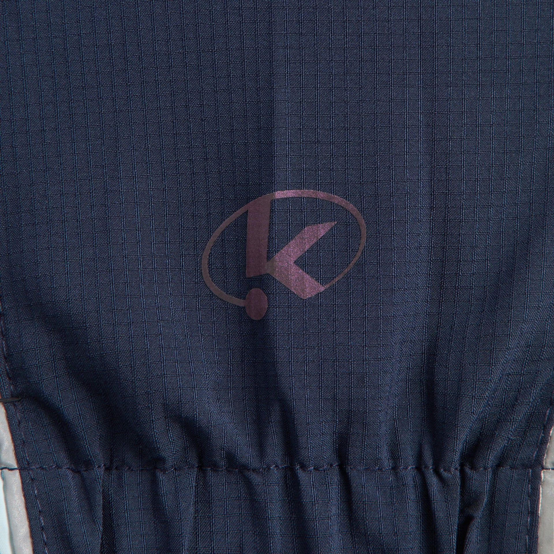 Kith Kids Lora Windbreaker Jacket close-up of elastic drawcord hem with K logo print