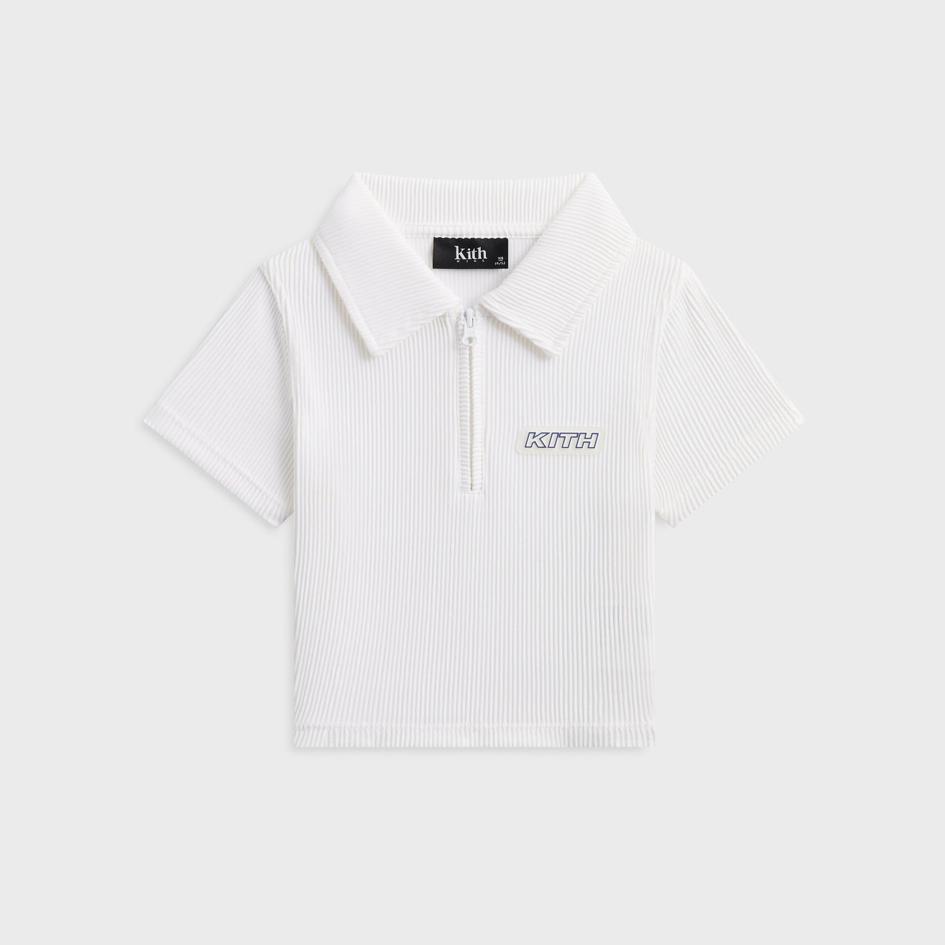 Kith Kids Active Fairway Polo in white, flat lay front view of ribbed quarter-zip polo with KITH chest logo