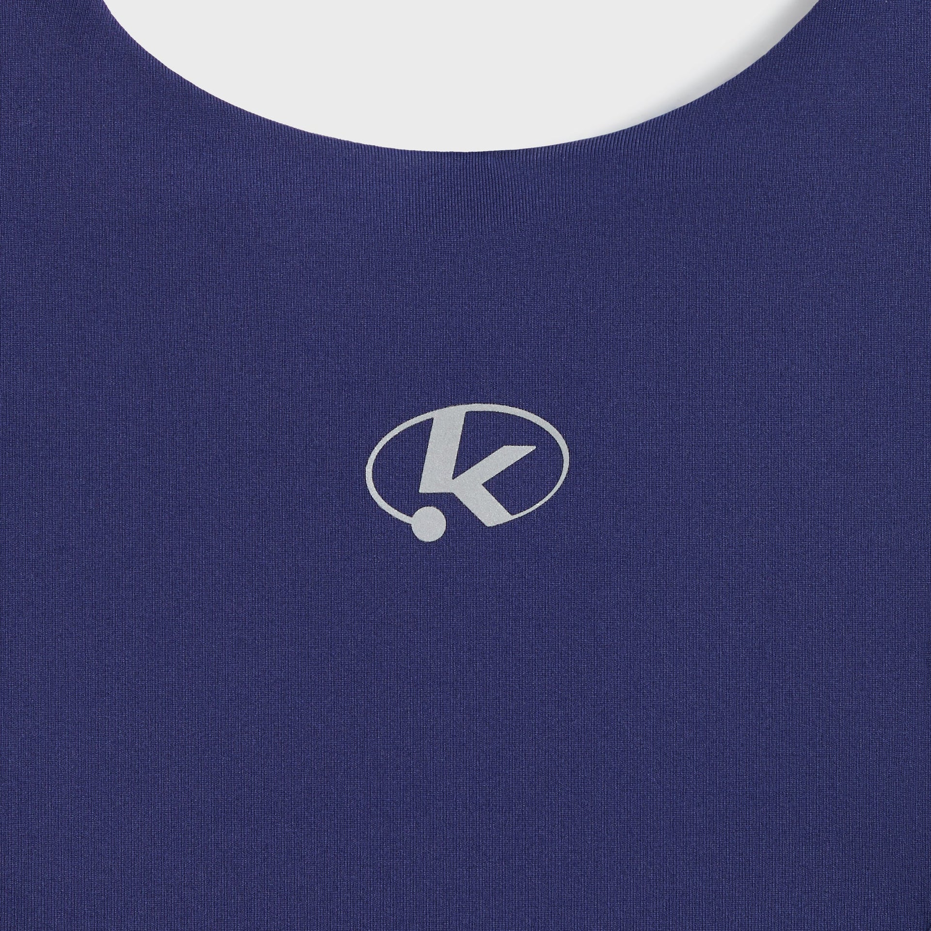 Close-up of Kith Kids Active Zamira Tank in Nocturnal navy back neckline with reflective oval K logo