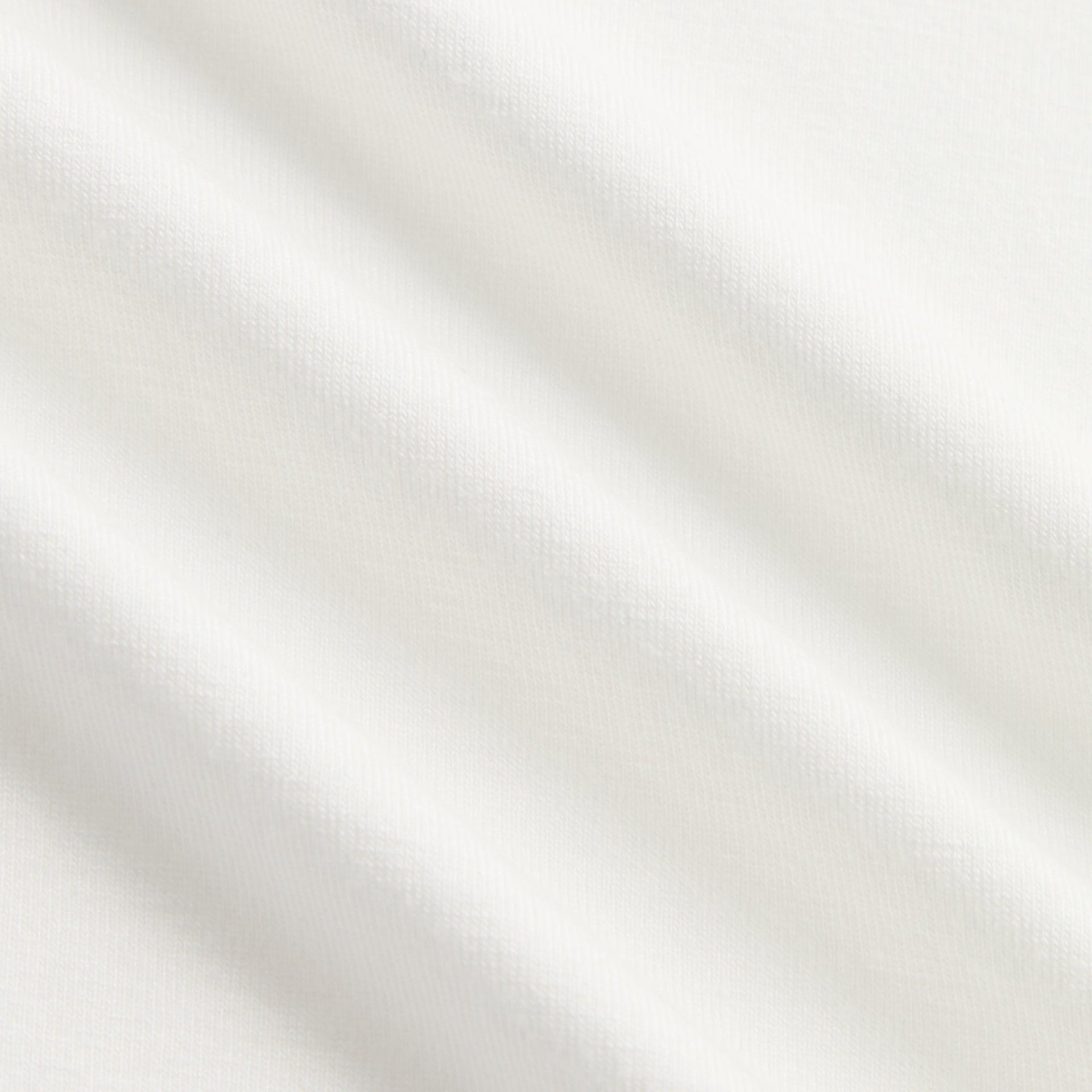Close-up of soft white cotton fabric texture of Kith Kids Fei Cropped Tee