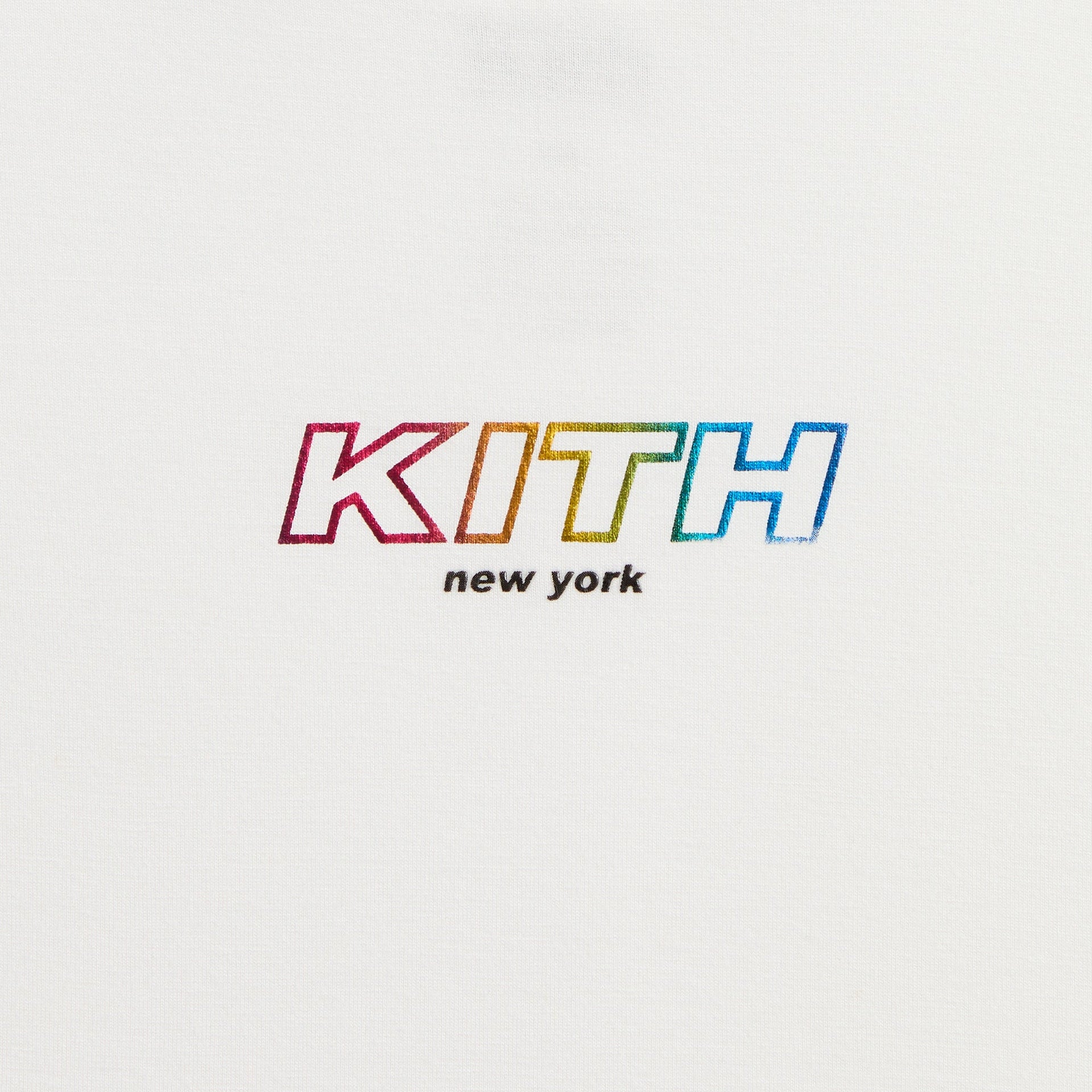 Close-up of rainbow gradient KITH New York logo print on white Kith Kids Fei Cropped Tee