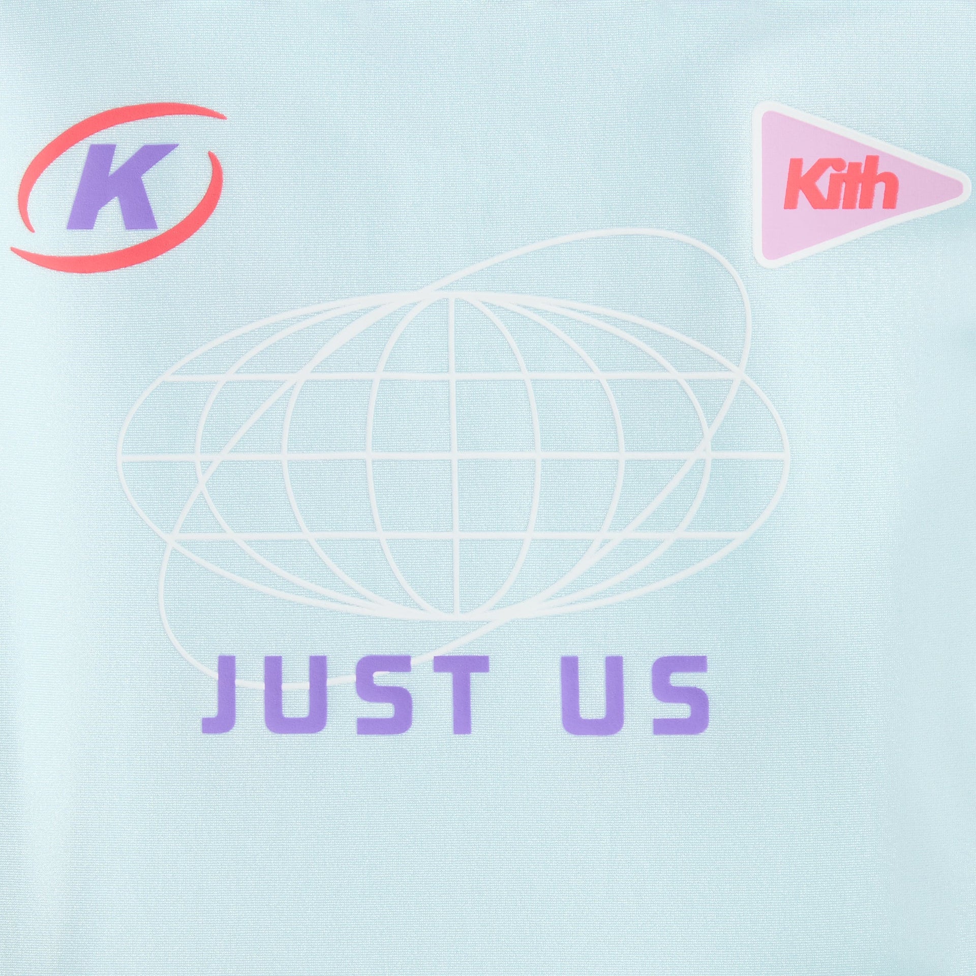 Kith Kids tee close-up of back Just Us globe graphic with K oval and pink Kith patches