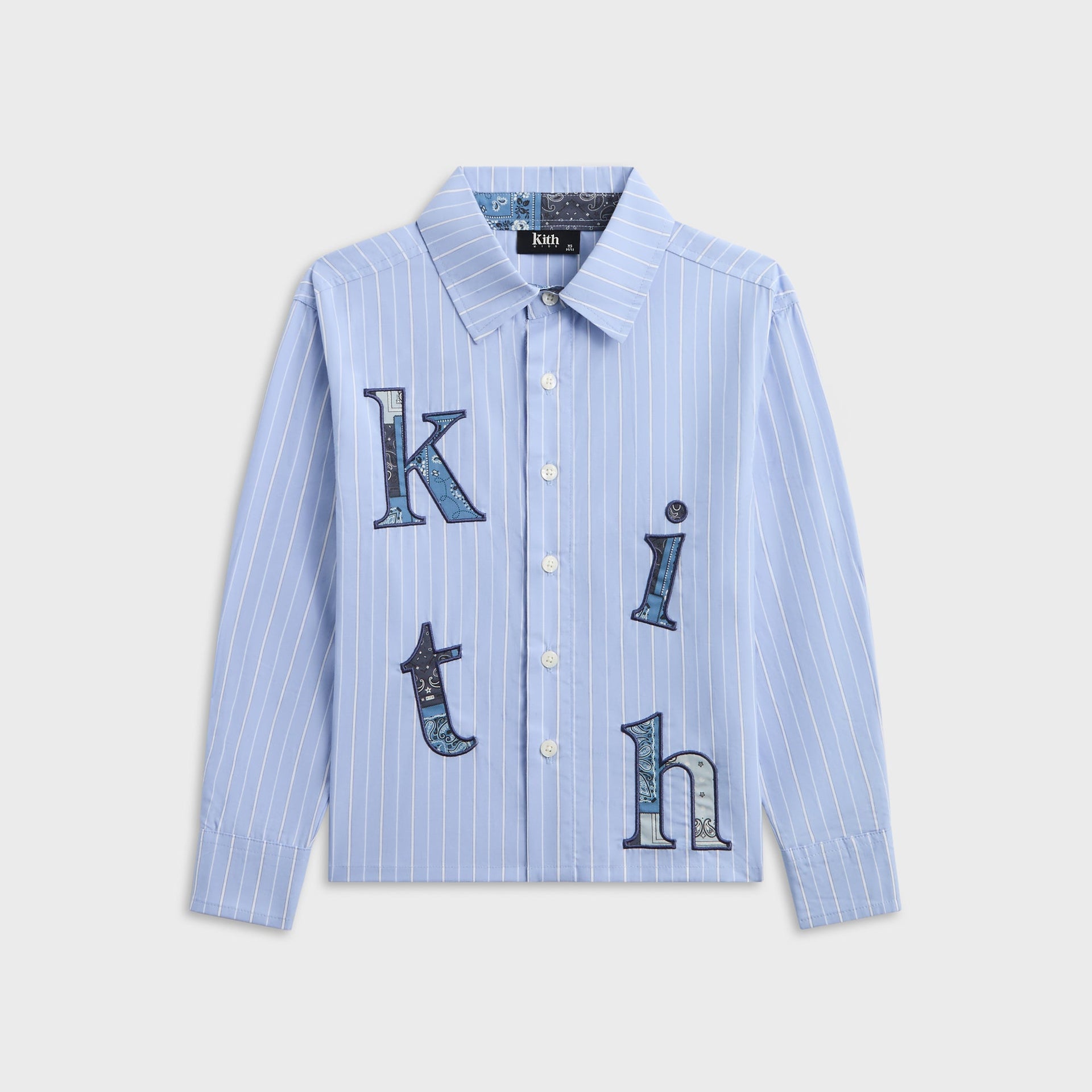 Kith Kids Berkeley shirt in Serene blue pinstripe, front view with bandana paisley applique kith lettering