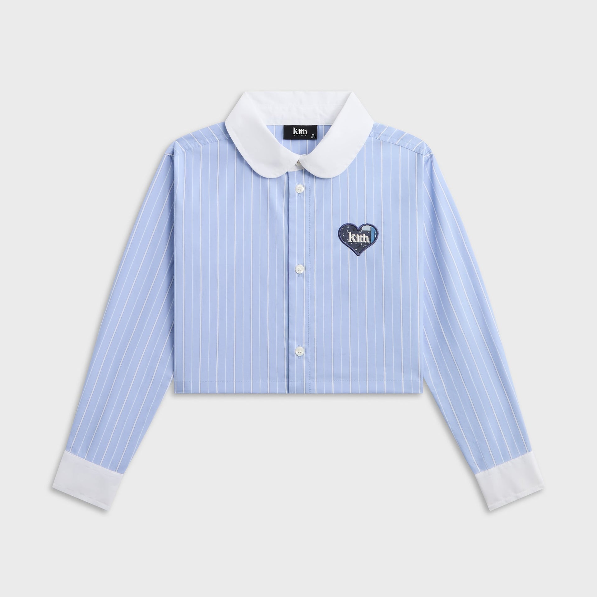 Kith Kids Cropped Apollo Shirt in blue and white stripe, front flat lay with white collar and heart patch