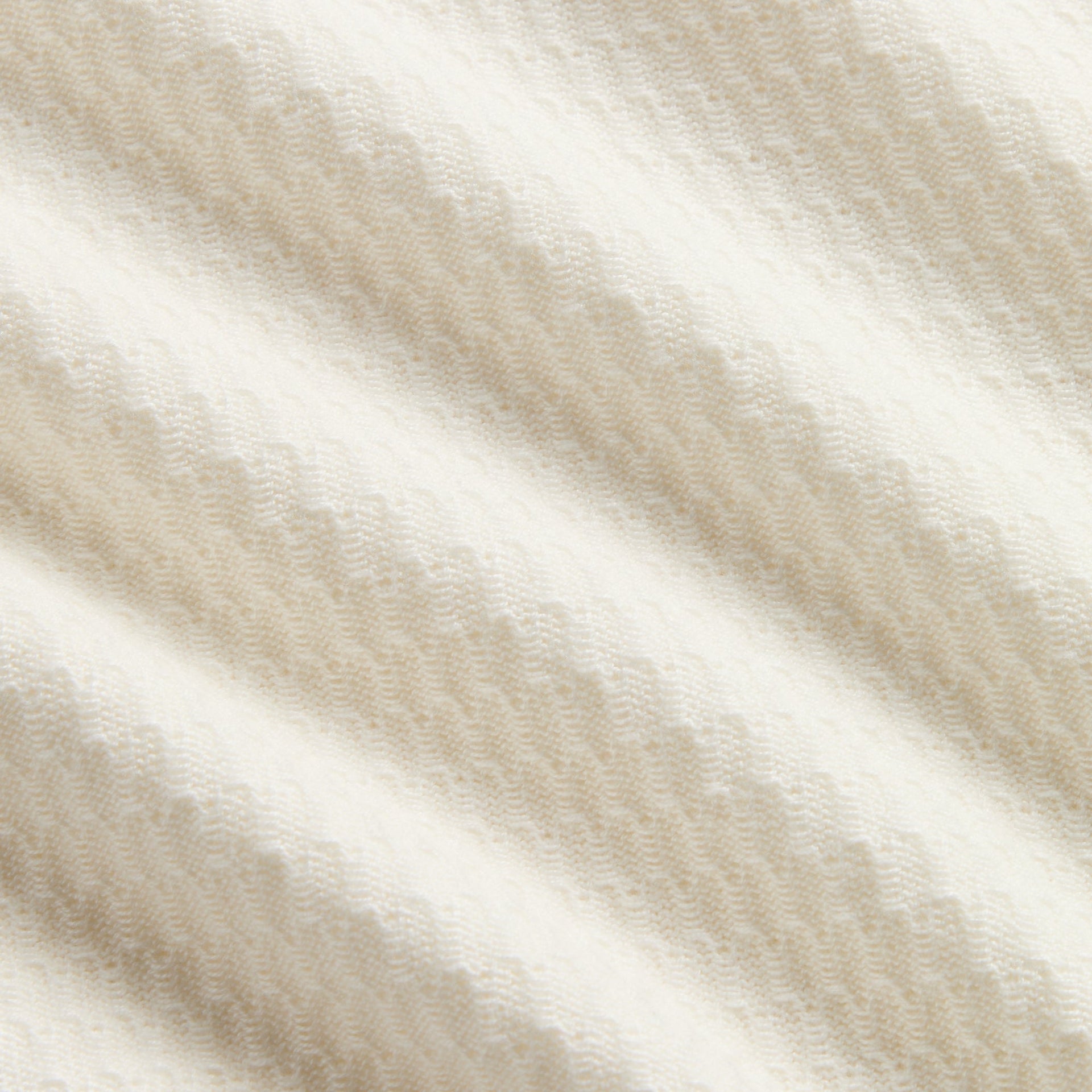 Kith Kids Tilden Polo close-up of cream textured knit fabric