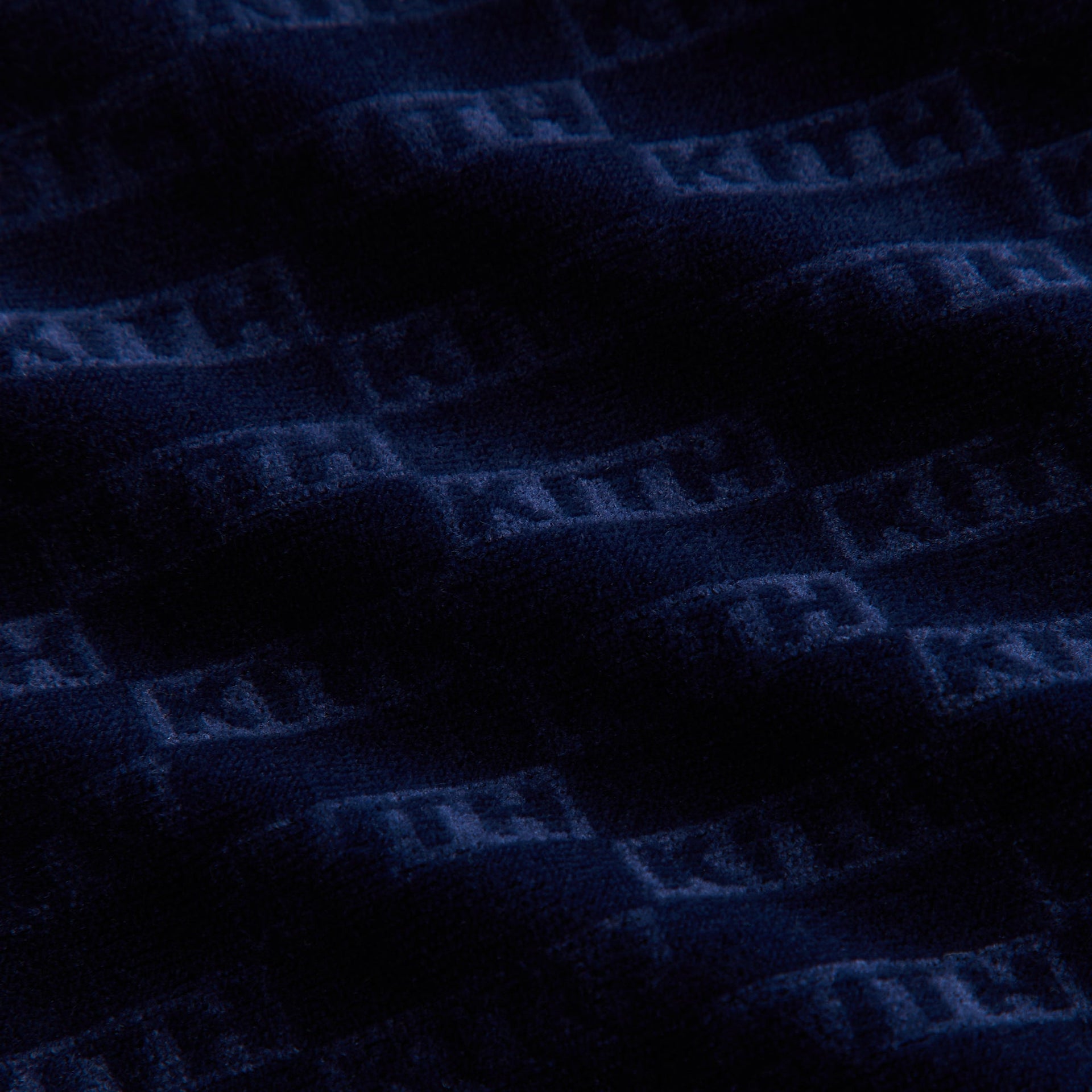 Kith Kids Monogram Velour Soccer Jersey, close-up of navy velour Kith monogram fabric texture