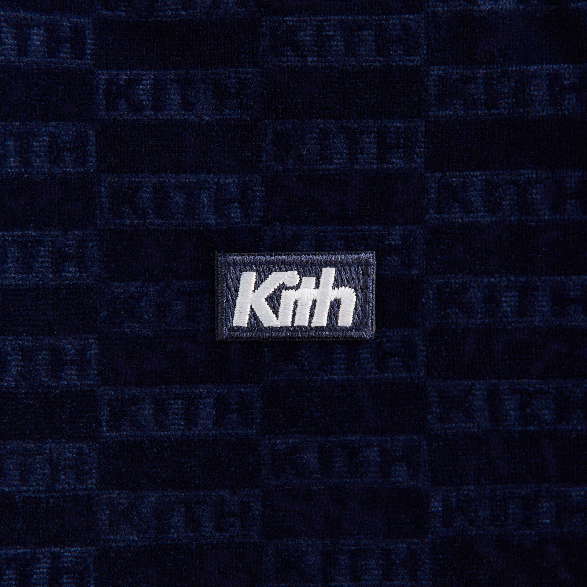 Kith Kids Monogram Velour Soccer Jersey, close-up of white Kith logo patch on navy velour monogram