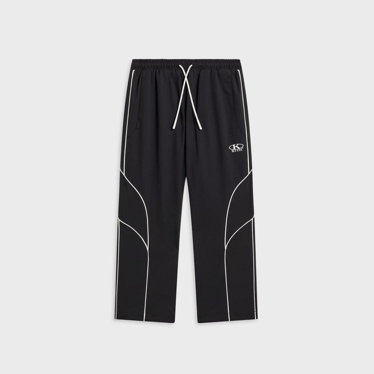 Kith Kids Novelty Dawson jogger in black with white piping, drawstring waist, and oval KITH logo at the hip