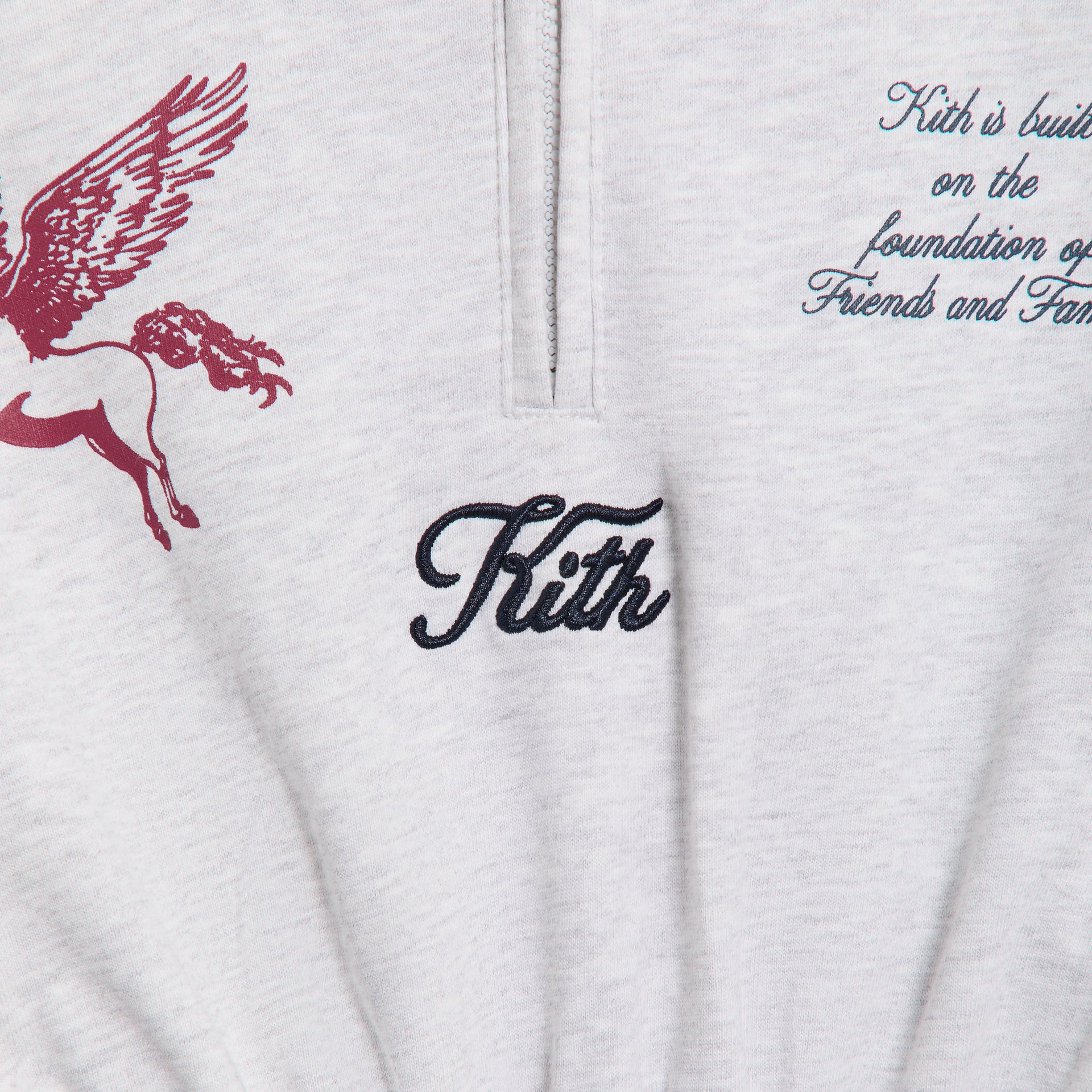 Kith Kids Hoodie Dress close-up of navy Kith script embroidery, quarter-zip and red Pegasus print
