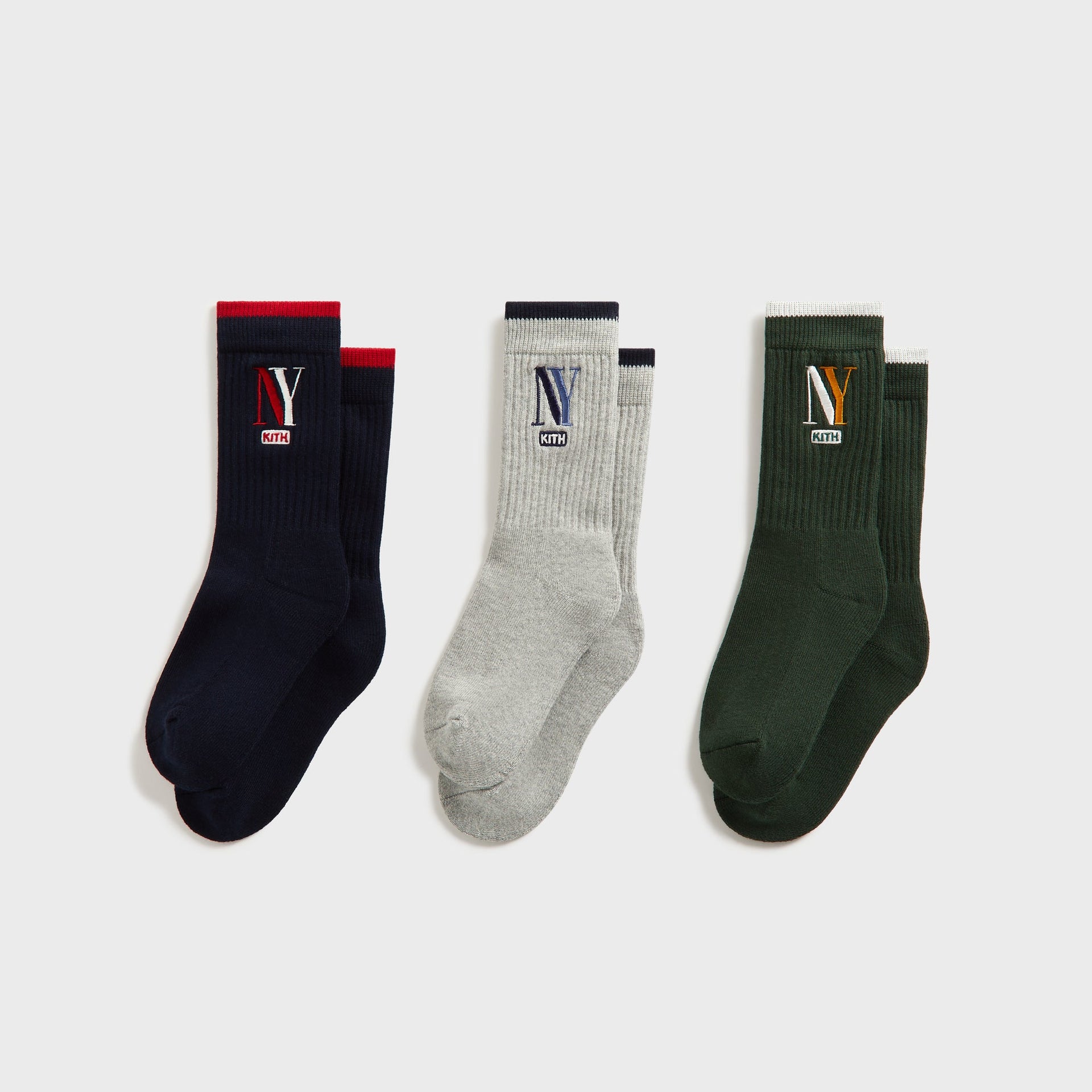 Kith Kids 3-Pack NY Socks in Multi, flat lay of navy, grey and green ribbed crew socks with NY logos