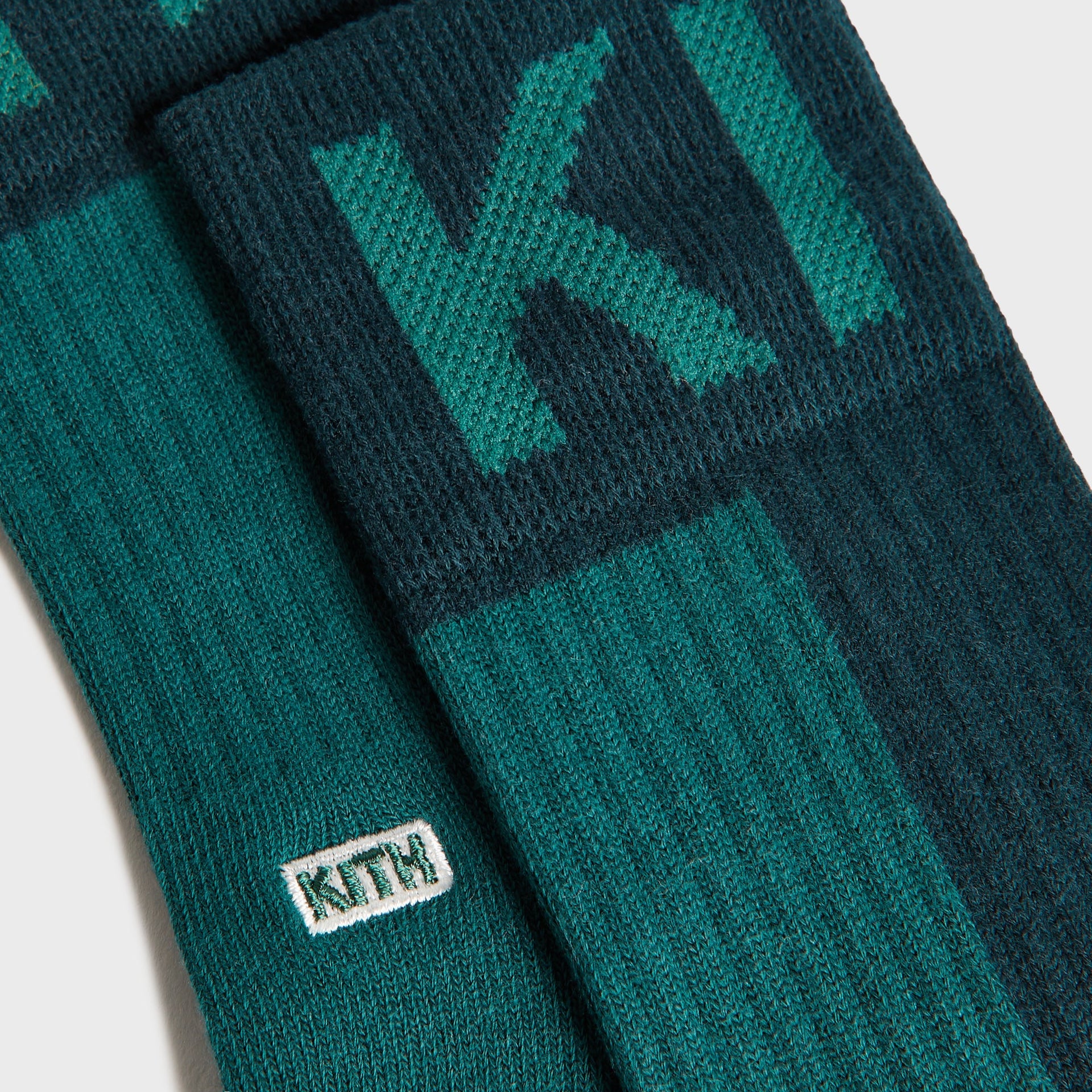 Kith Kids 3-Pack Color-Blocked Socks close-up of green and navy pair with KITH knit lettering and label
