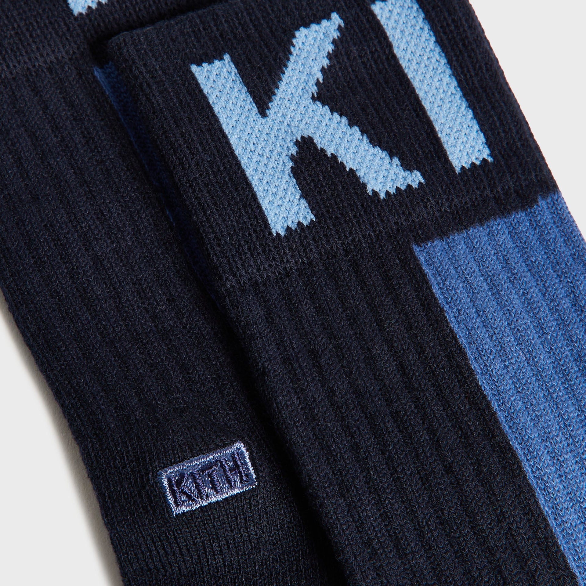 Kith Kids 3-Pack Color-Blocked Socks close-up of navy and blue pair with light blue KITH lettering