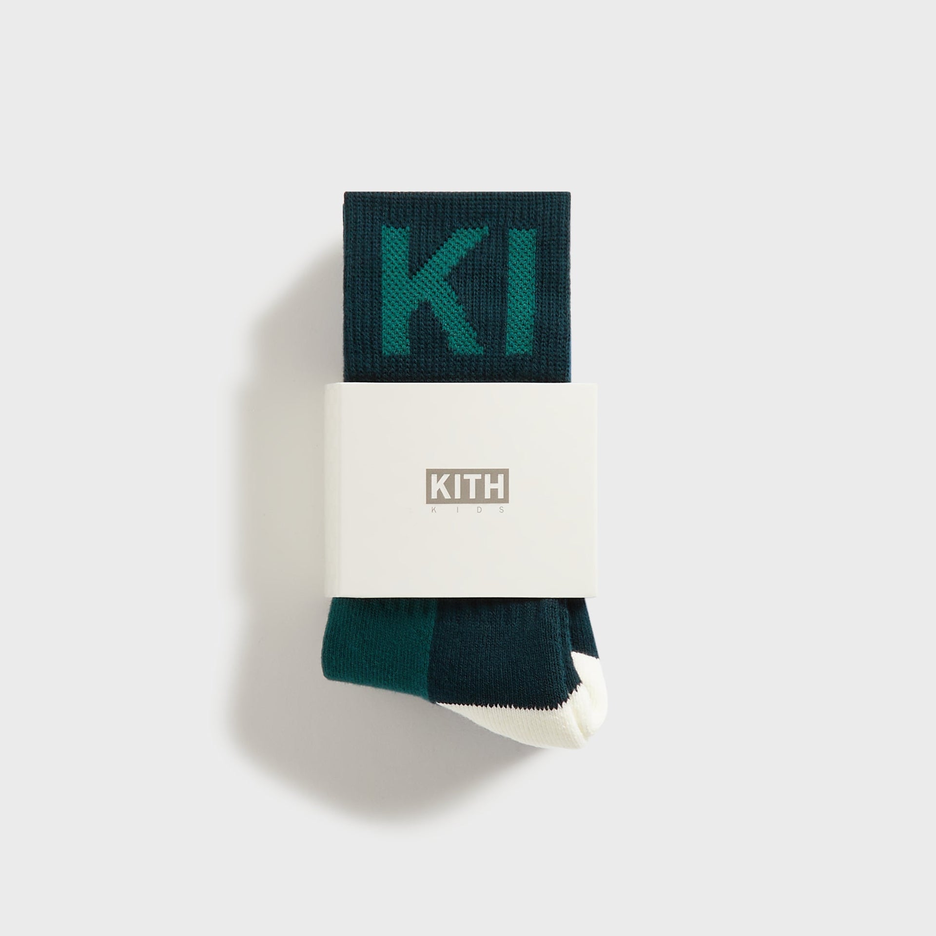 Kith Kids 3-Pack Color-Blocked Socks green pair folded in white KITH Kids packaging band