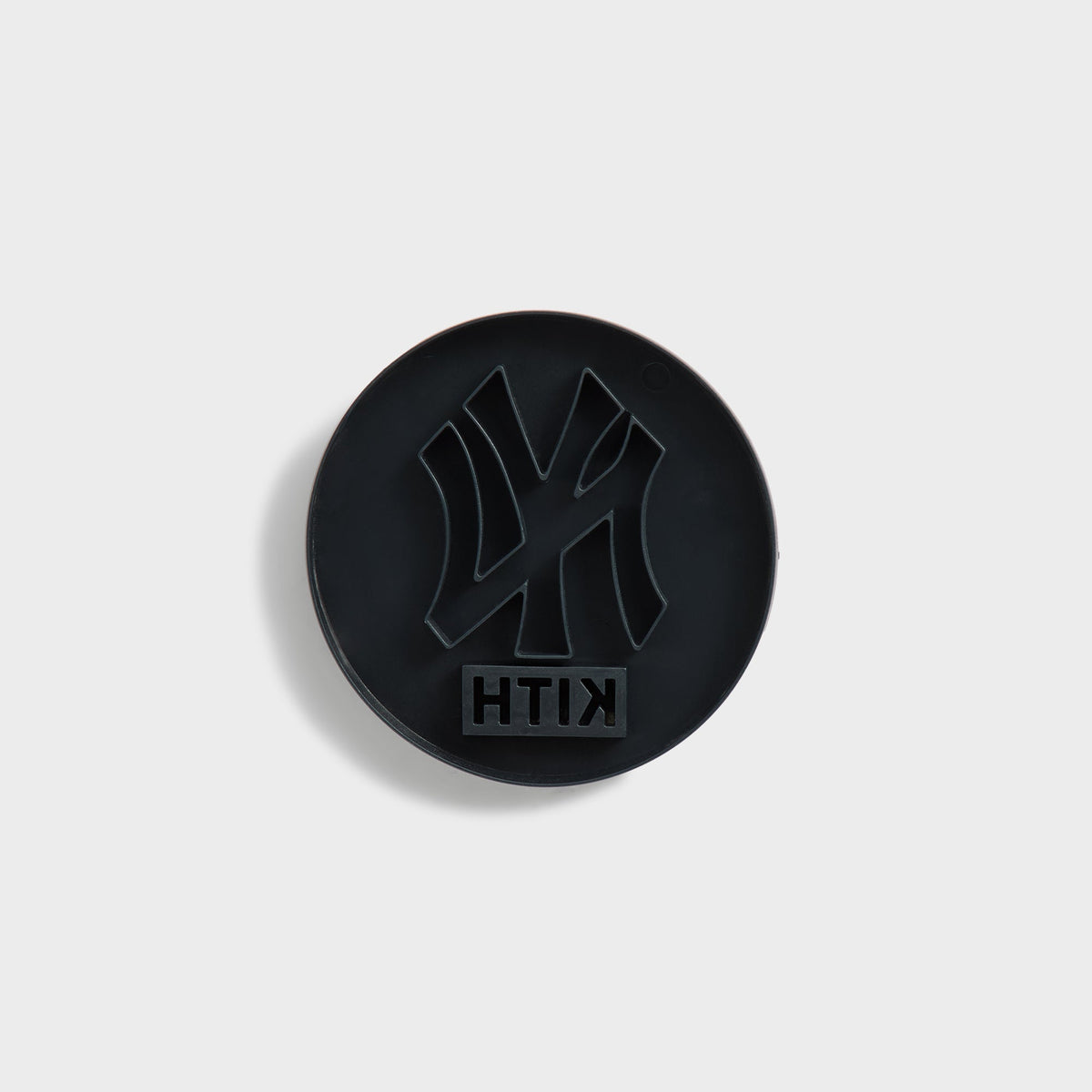 Kith for the New York Yankees cookie cutter in black, top view showing the NY logo cutout and Kith text